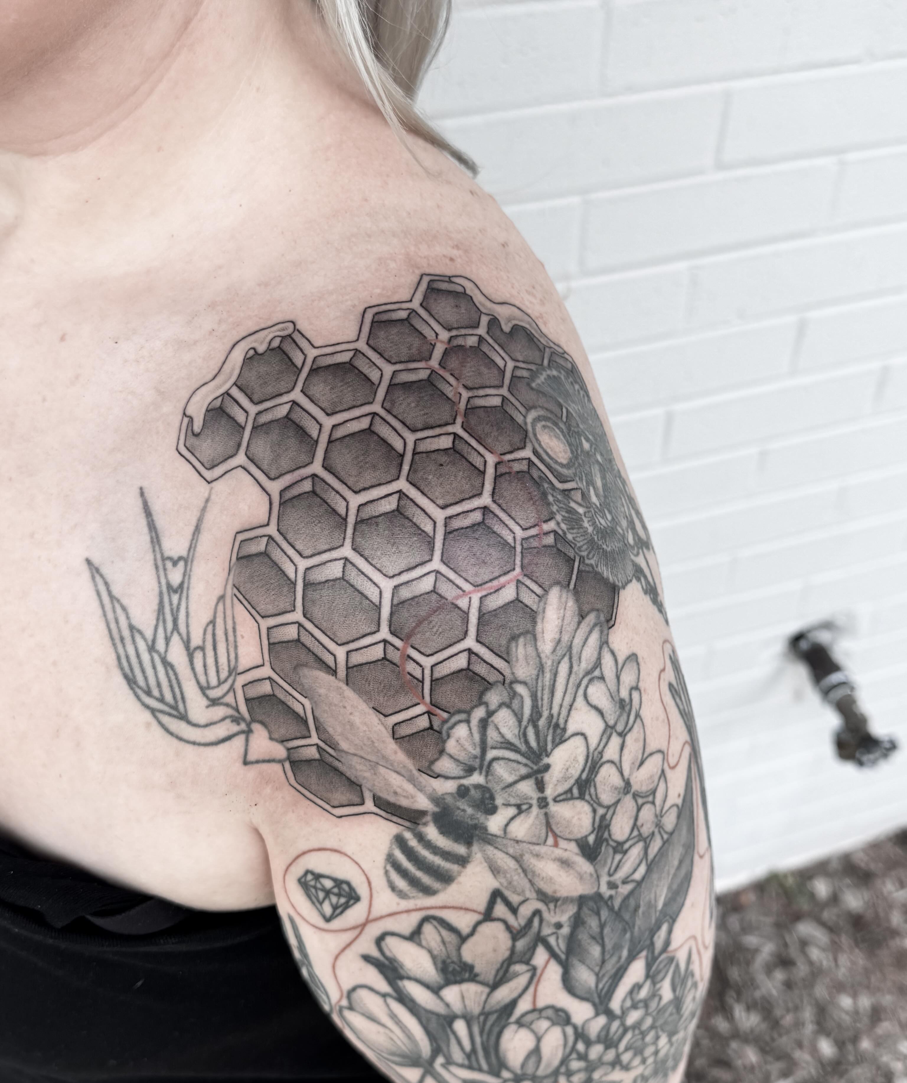Honeycomb and bee geometric tattoo on the shoulder by Audrey Kacel, Holland, Michigan