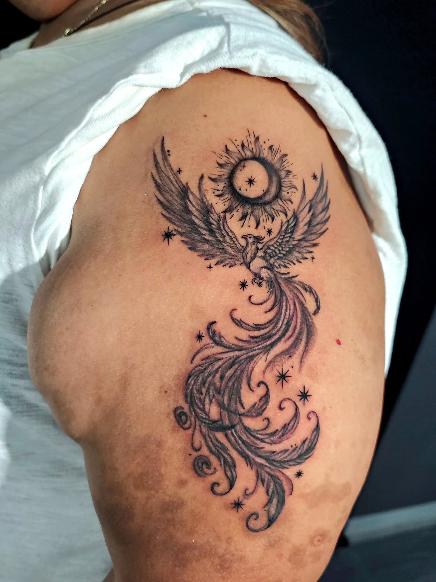 Phoenix neo-traditional tattoo on the shoulder by Lili Gu