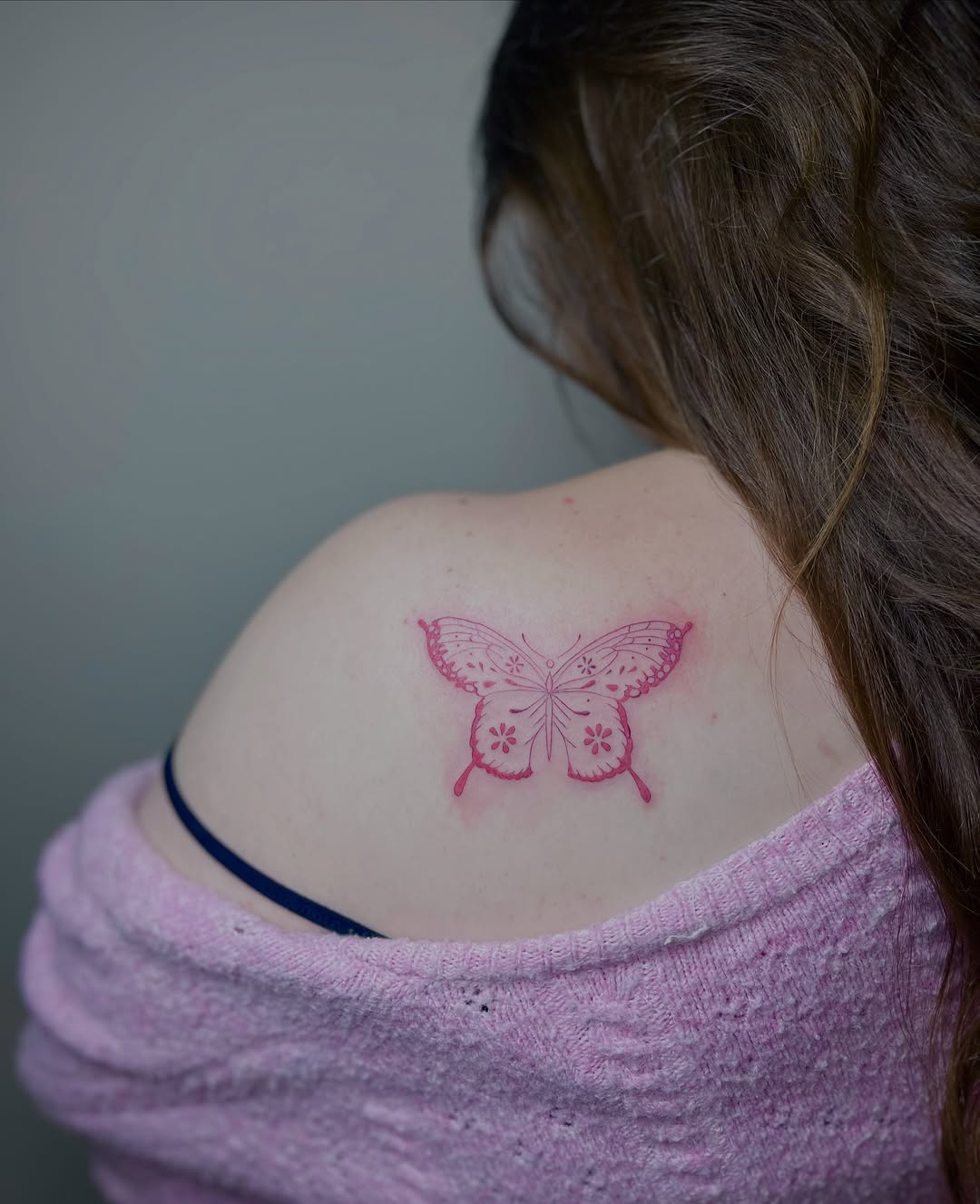 Pink butterfly fine line tattoo on the shoulder by brinley - fine line tattoos, Crescent Springs, Kentucky