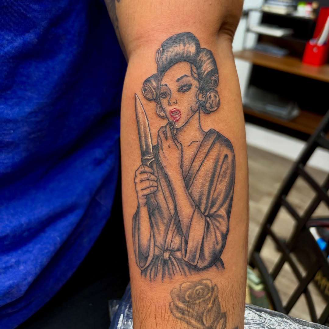 Woman with knife black and grey tattoo on the forearm by Zeninkz