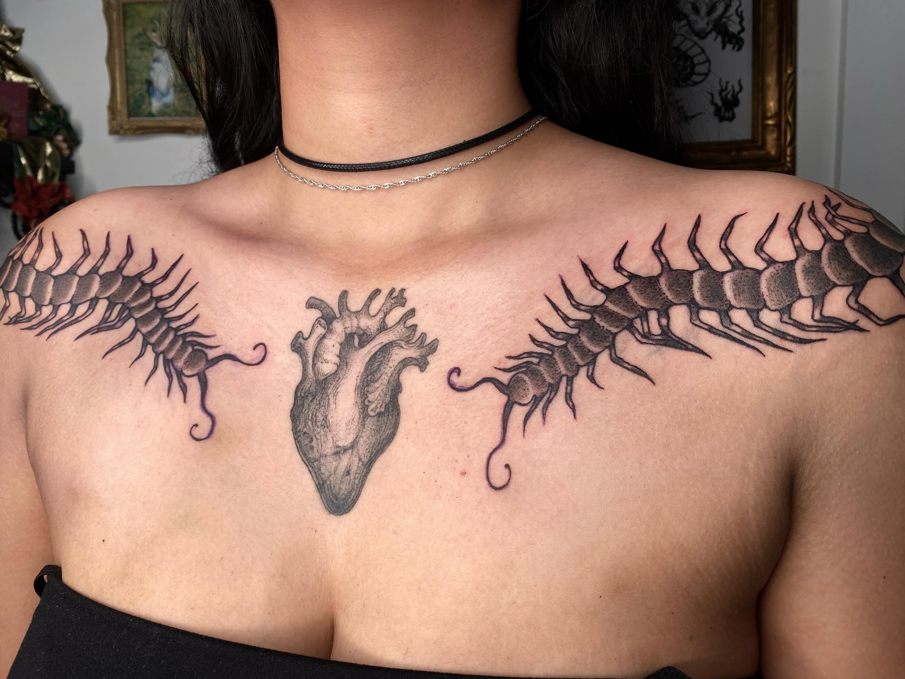 Heart with centipede wings realism tattoo on the chest by sarah 🗝️