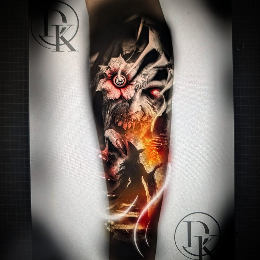 Zombie face with witch and flower realism tattoo on the forearm by Drew King