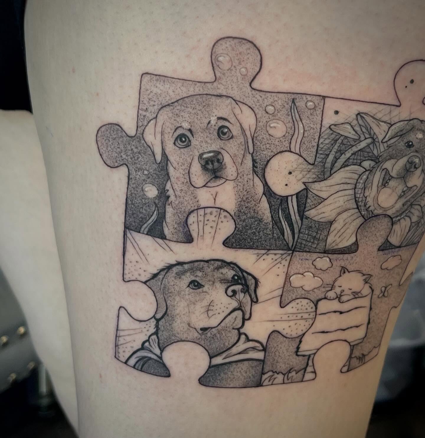 Dogs and puzzle pieces dotwork tattoo on the forearm by Freya Petersen
