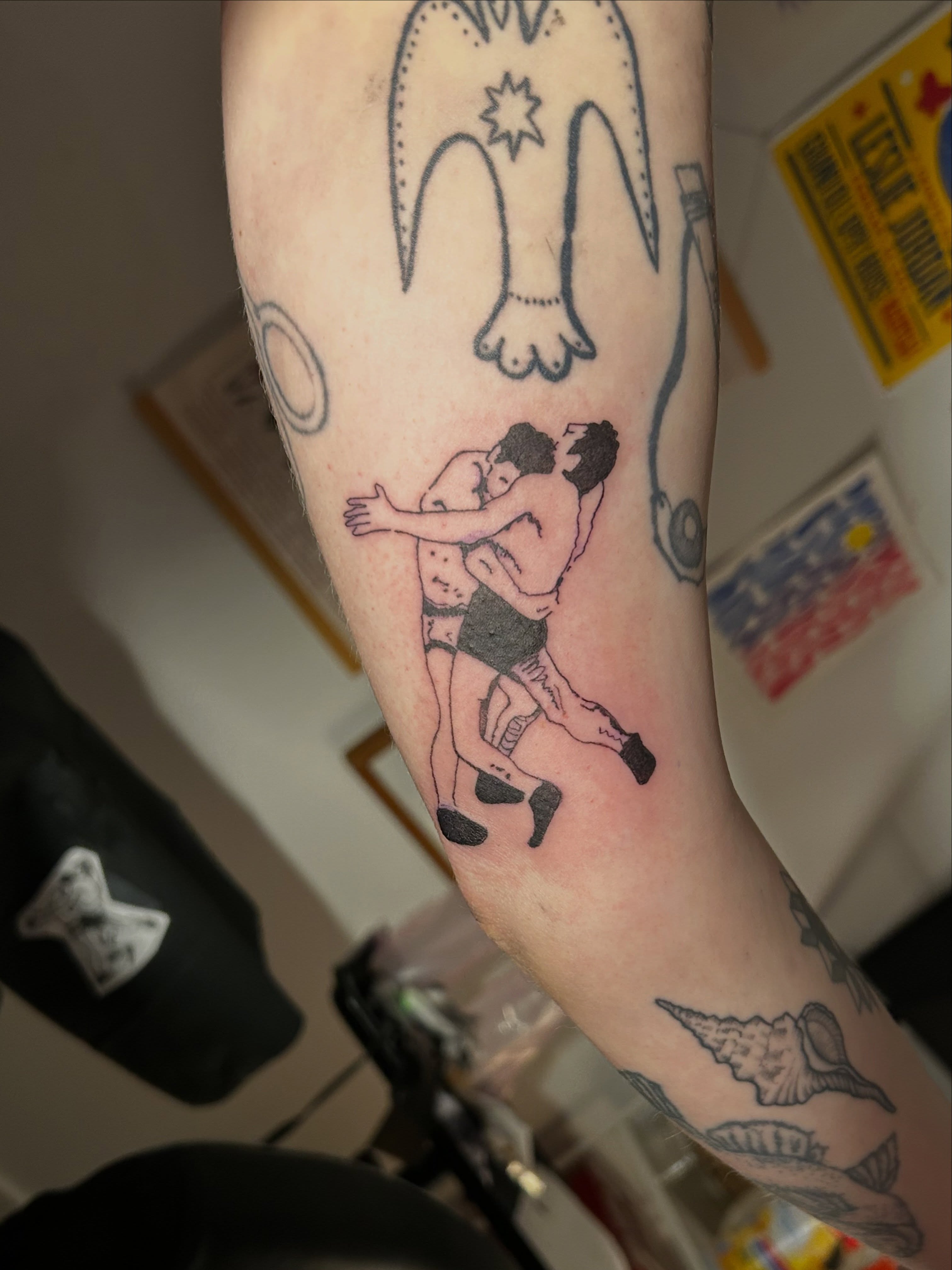 Wrestling couple American traditional tattoo on the forearm by Mattie Robinson