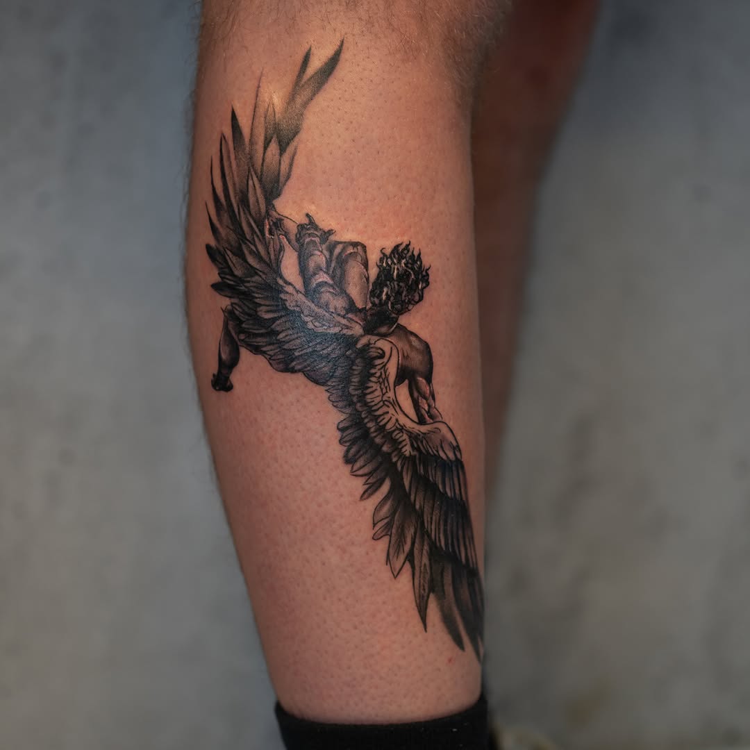 Angelic figure realism tattoo on the calf by Damon Valdez