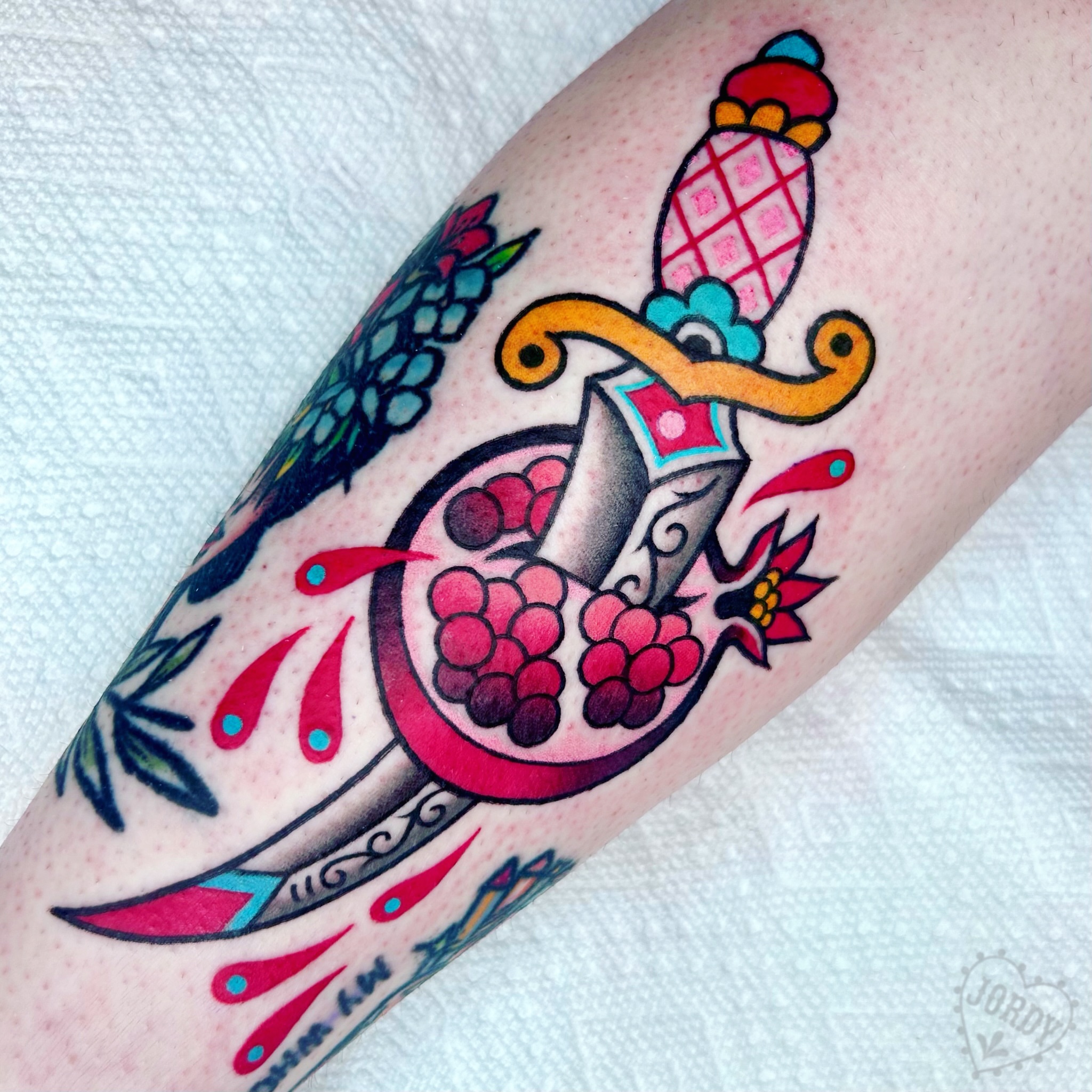 Pomegranate and dagger American traditional tattoo on the forearm by jordy, Philadelphia, Pennsylvania