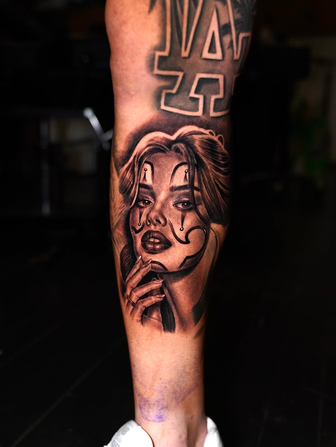 Chola clown girl portrait Chicano tattoo on the forearm by Luis Peña