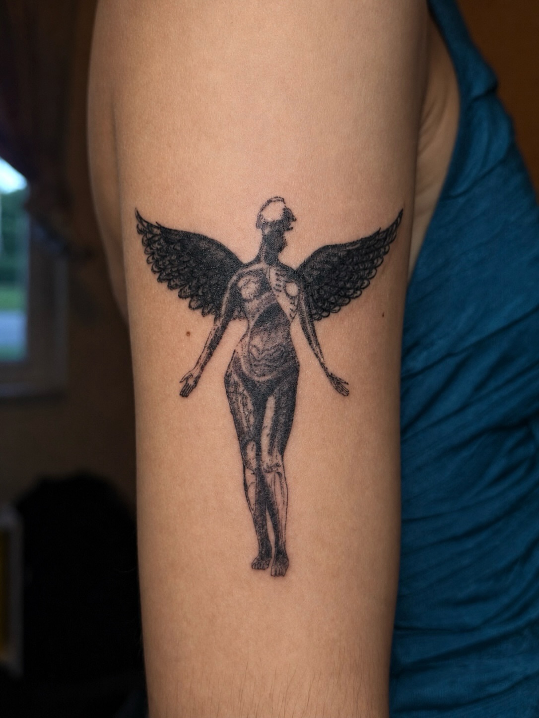 Winged angel black and grey tattoo on the forearm by ππππππ