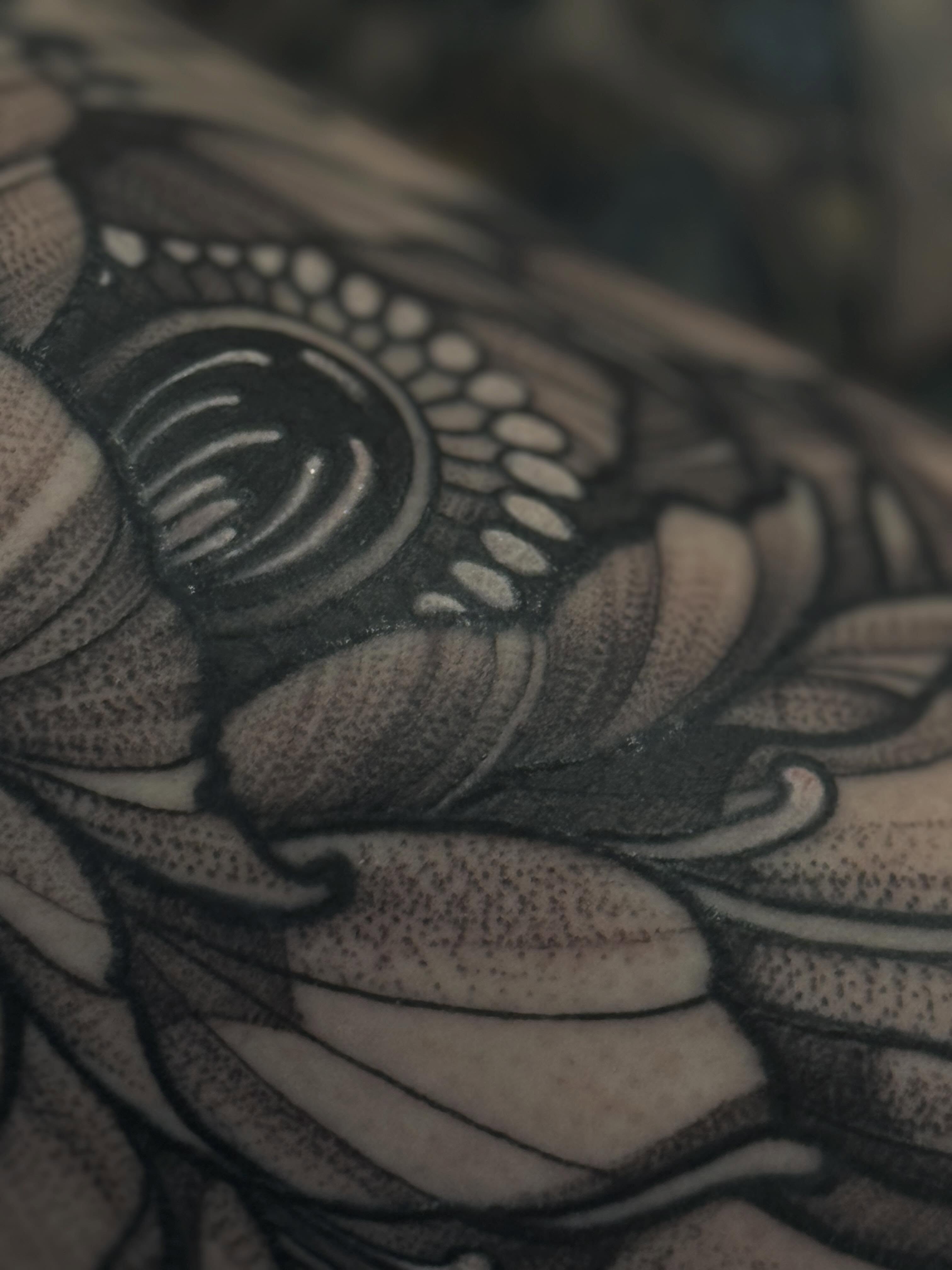 Lotus flower dotwork tattoo on the forearm by Keith Smith
