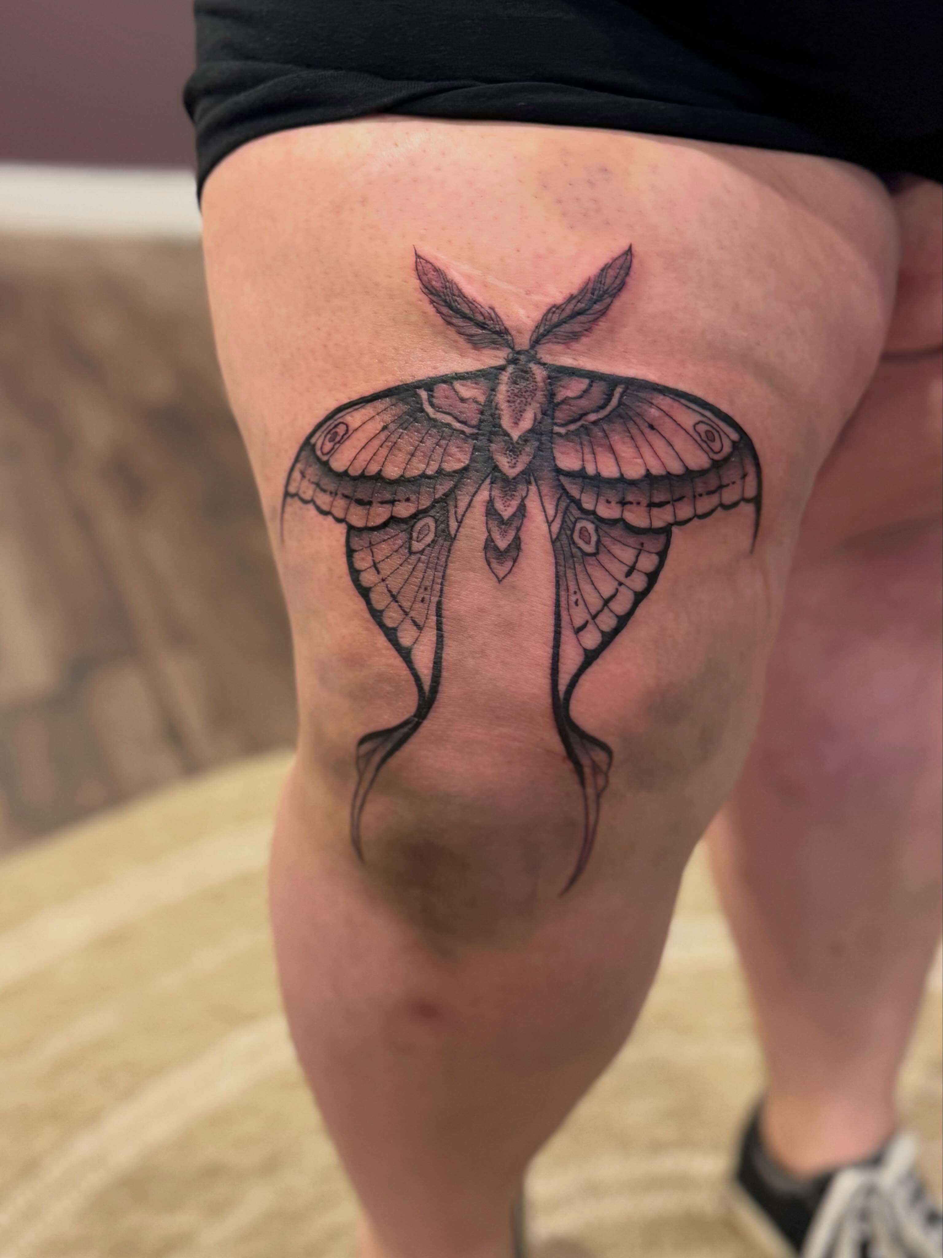 Moth black and grey tattoo on the thigh by Aly Rucker, Murfreesboro, Tennessee