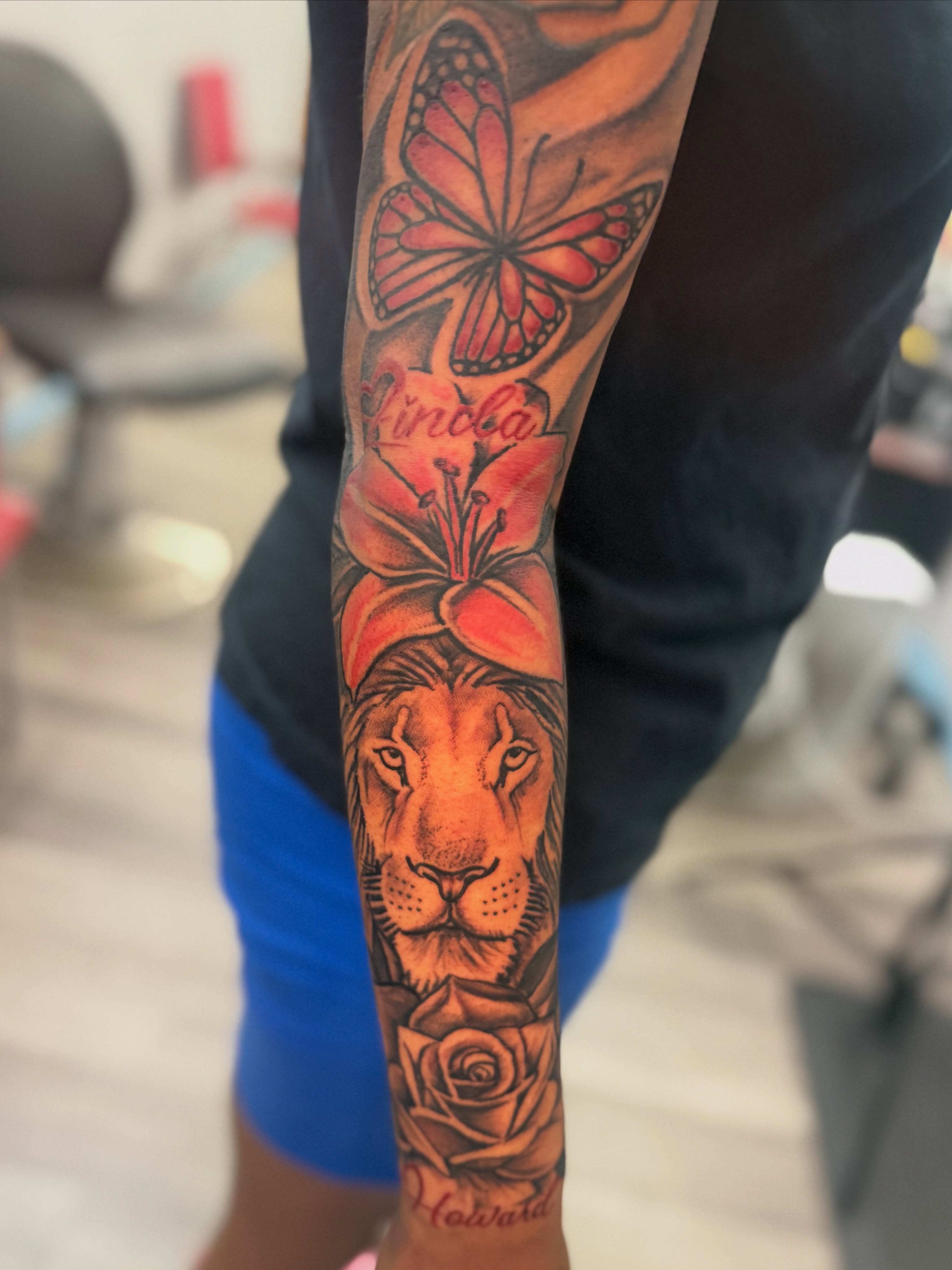 Lion and butterfly realism tattoo on the forearm by JAE, Shreveport, Louisiana
