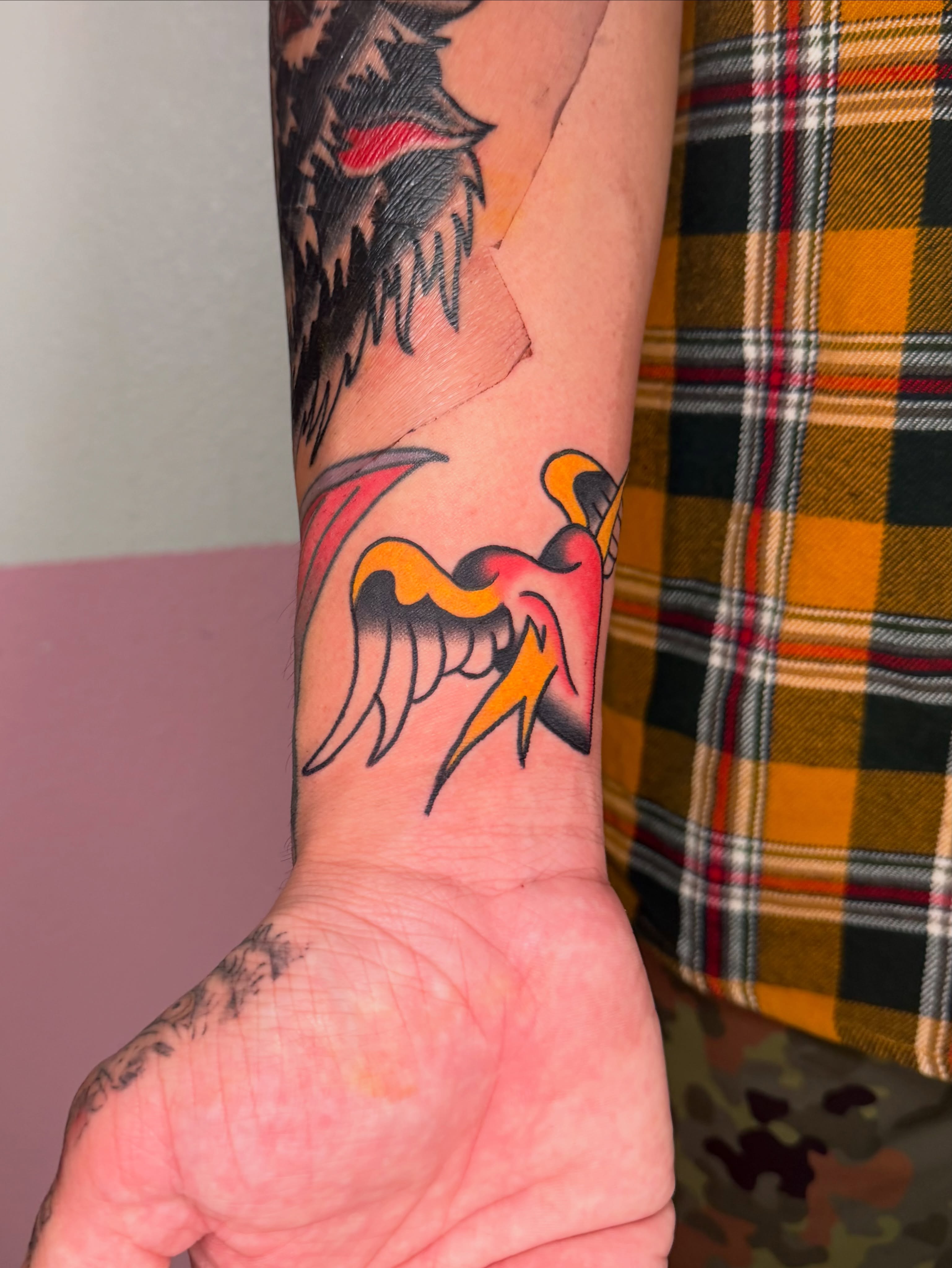 Flaming bird American traditional tattoo on the forearm by ⊹₊⟡⋆ 𝕵𝖔𝖎𝖊 ⊹₊⟡⋆