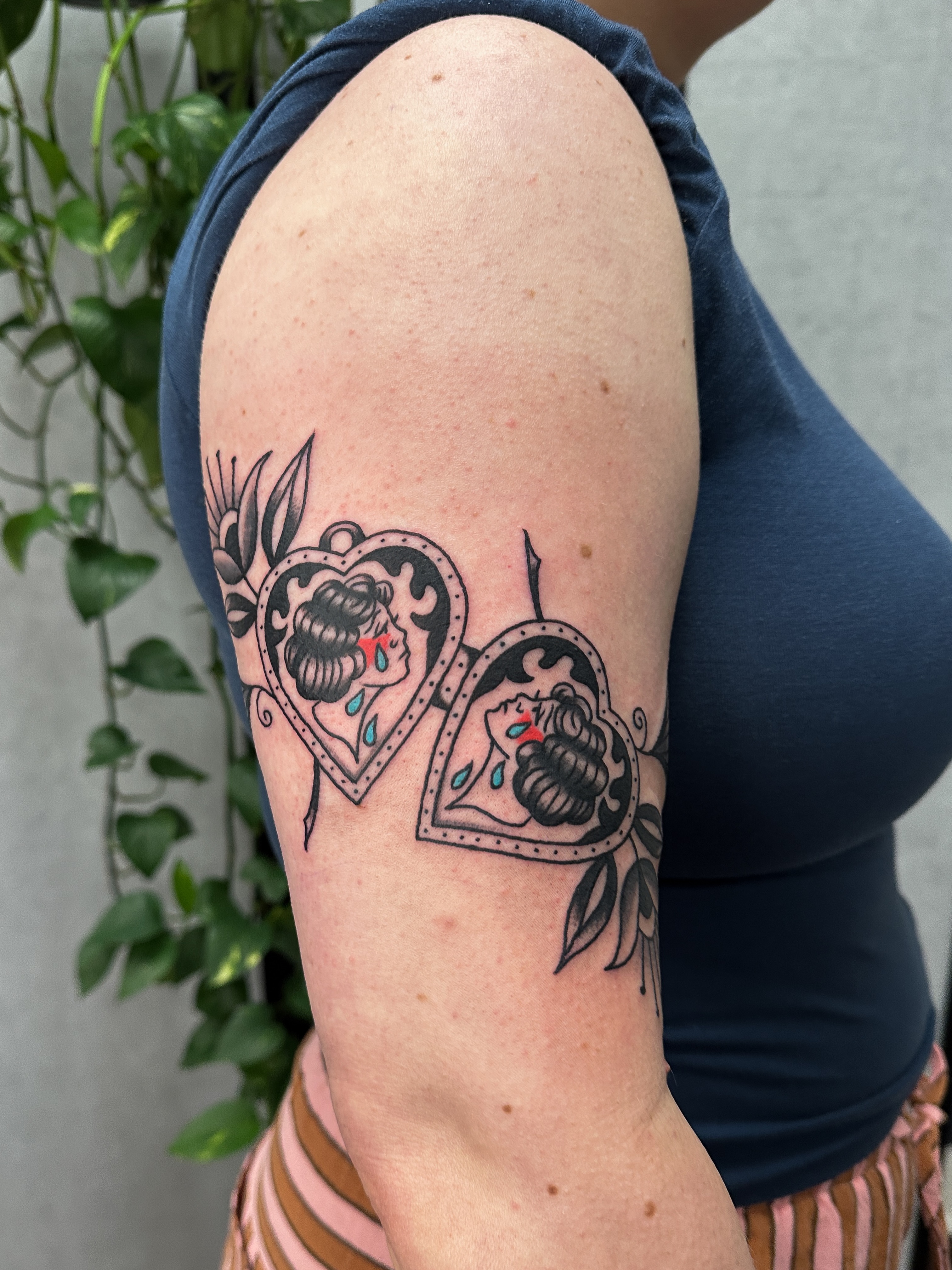 Tears and roses American traditional tattoo on the shoulder by Hannah Eddy