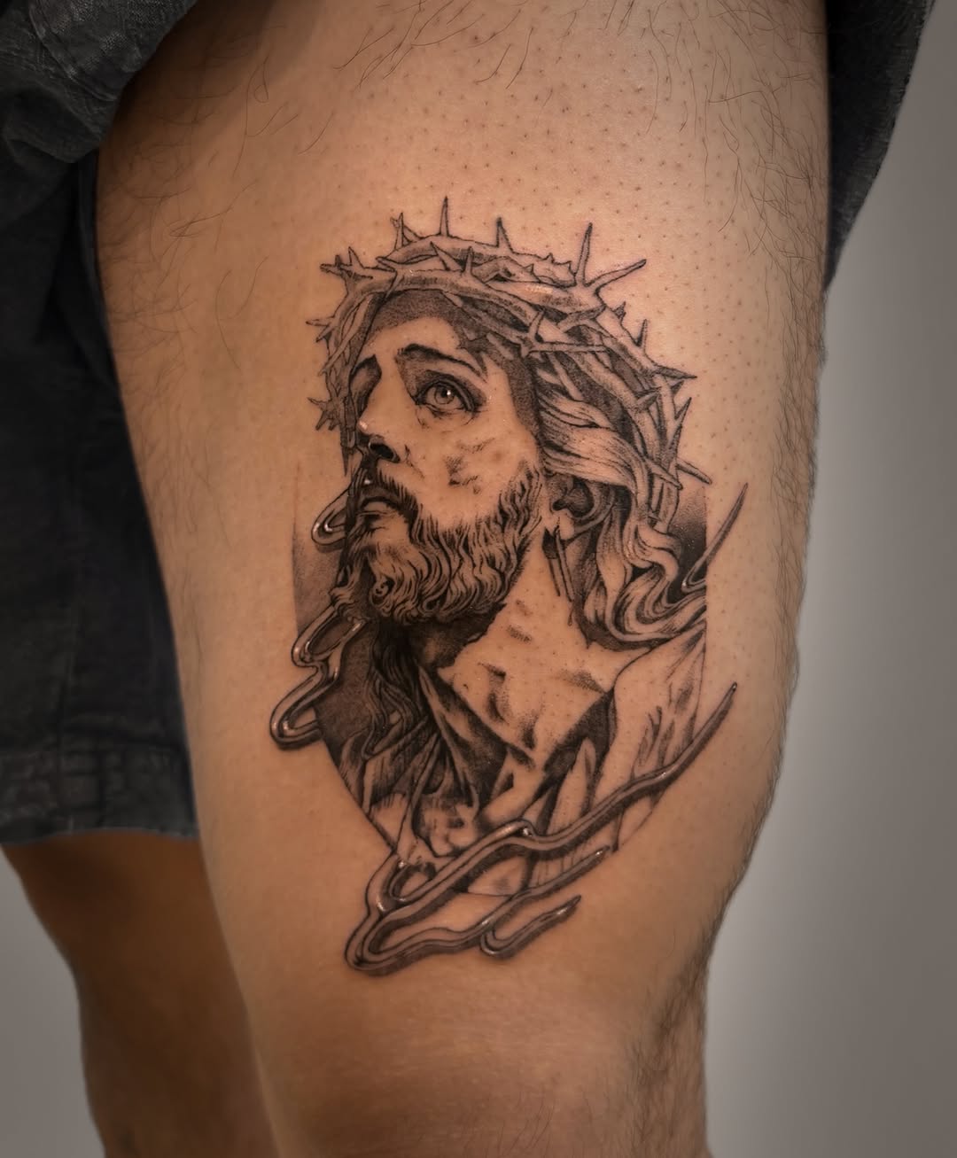 Jesus Christ portrait realism tattoo on the thigh by Hery Anwar