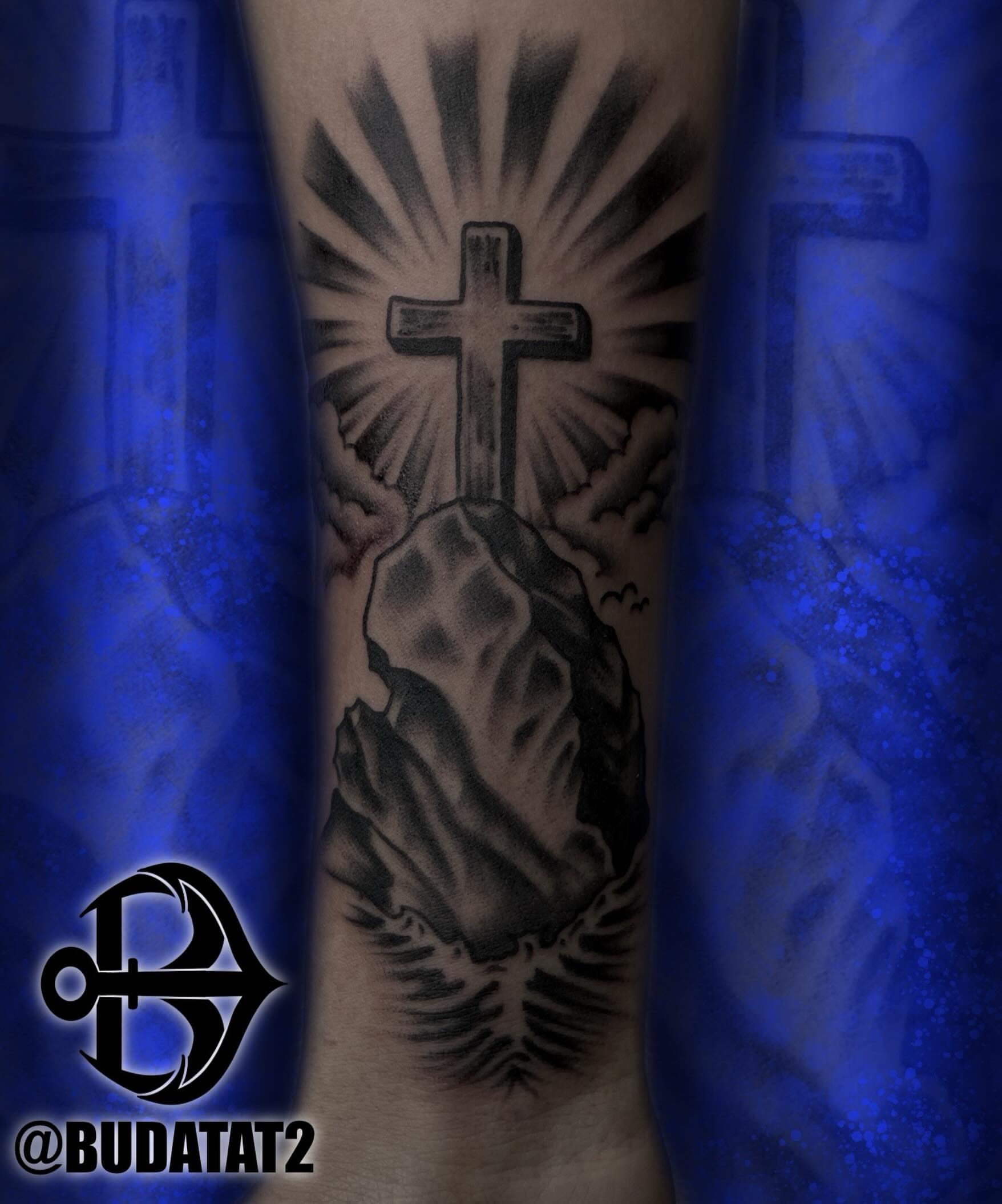 Cross and rock black and grey tattoo on the forearm by Brandon Heredia, Vacaville, California