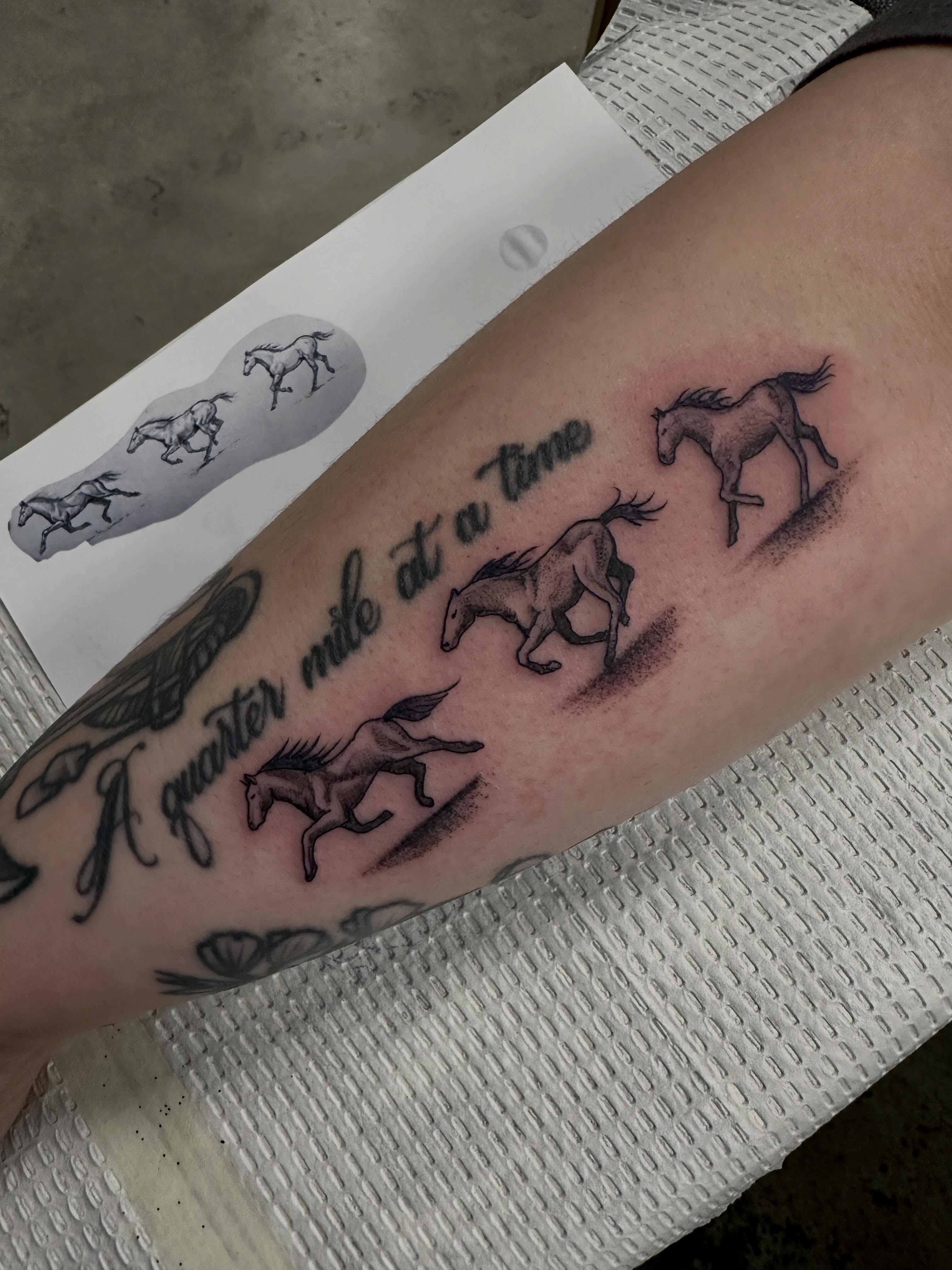 Horses running dotwork tattoo on the forearm by Vincent Merys