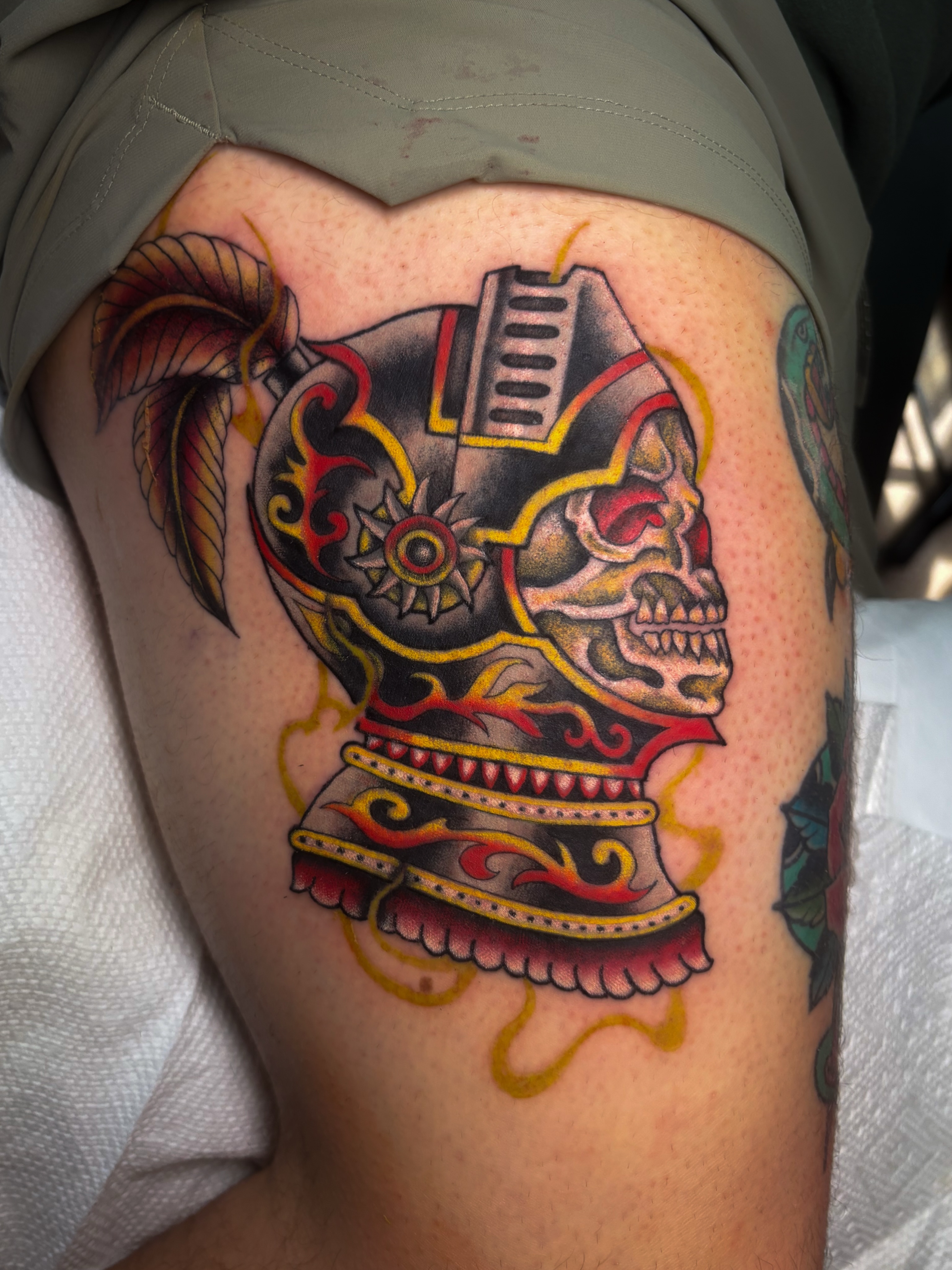 Skull with helmet American traditional tattoo on the thigh by Sal