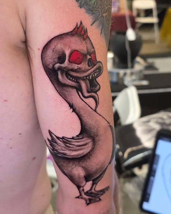 Chicken American traditional tattoo on the forearm by Tank Maass