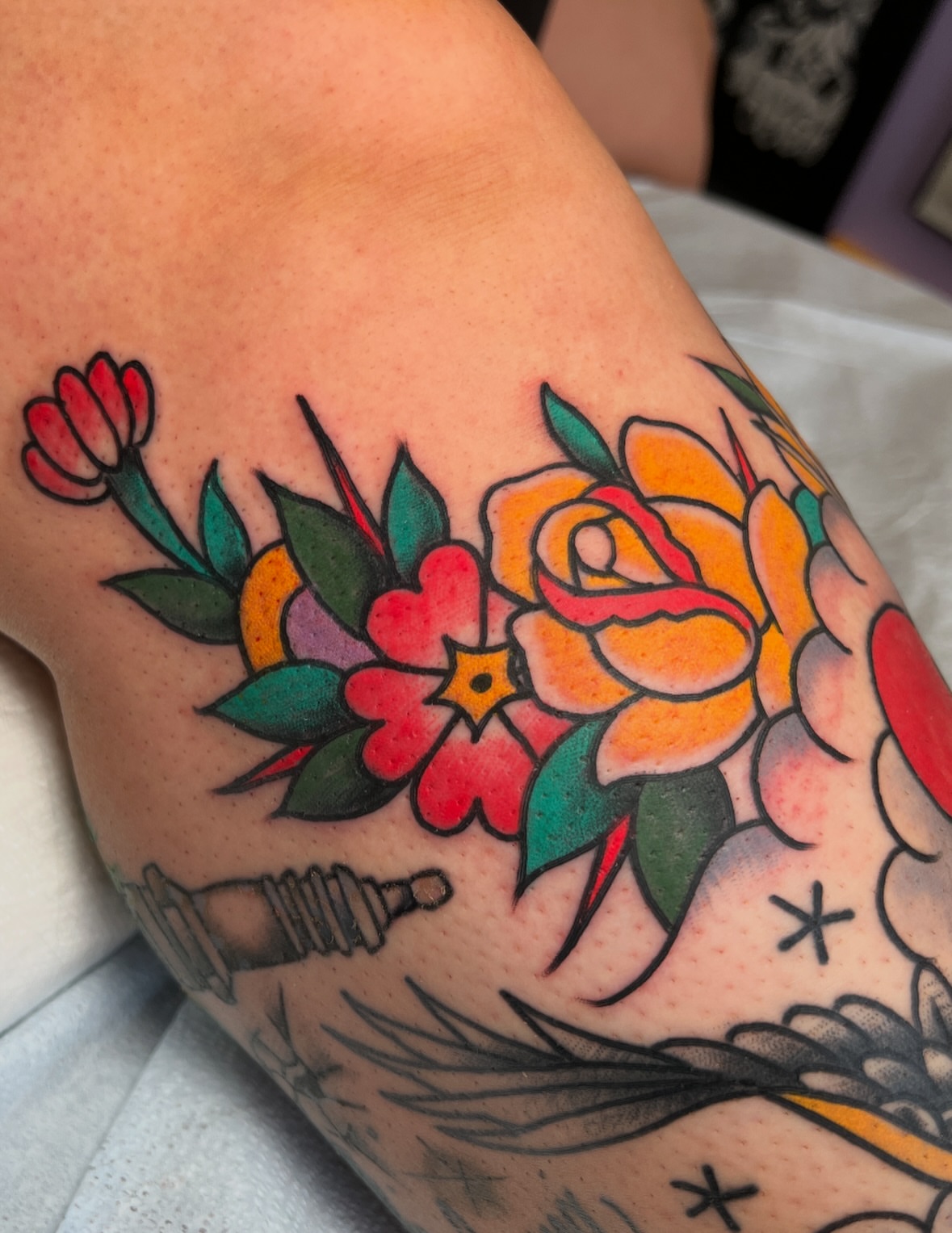 Floral bouquet American traditional tattoo on the forearm by Mat Helton, Fairborn, Ohio