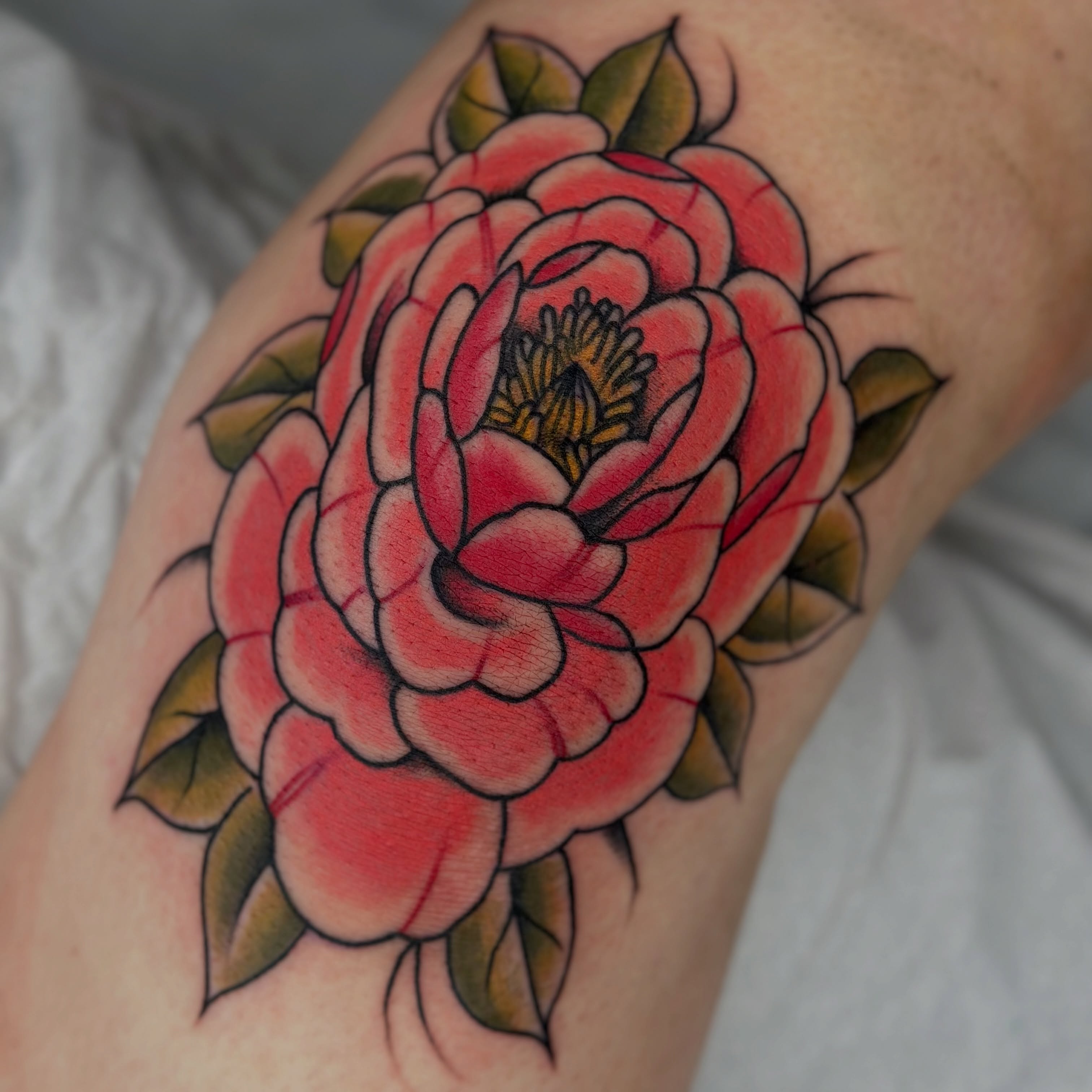 Peony American traditional tattoo on the forearm by Sarah Christine Tattoo, Calgary, Alberta