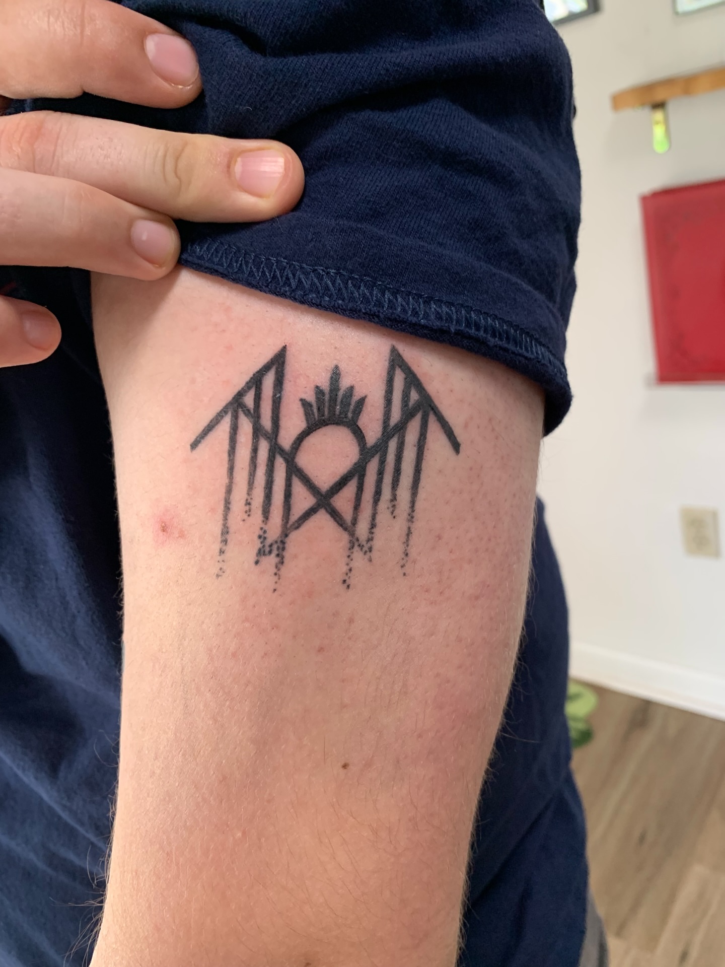 Geometric symbol geometric tattoo on the thigh by Sam Ingalls