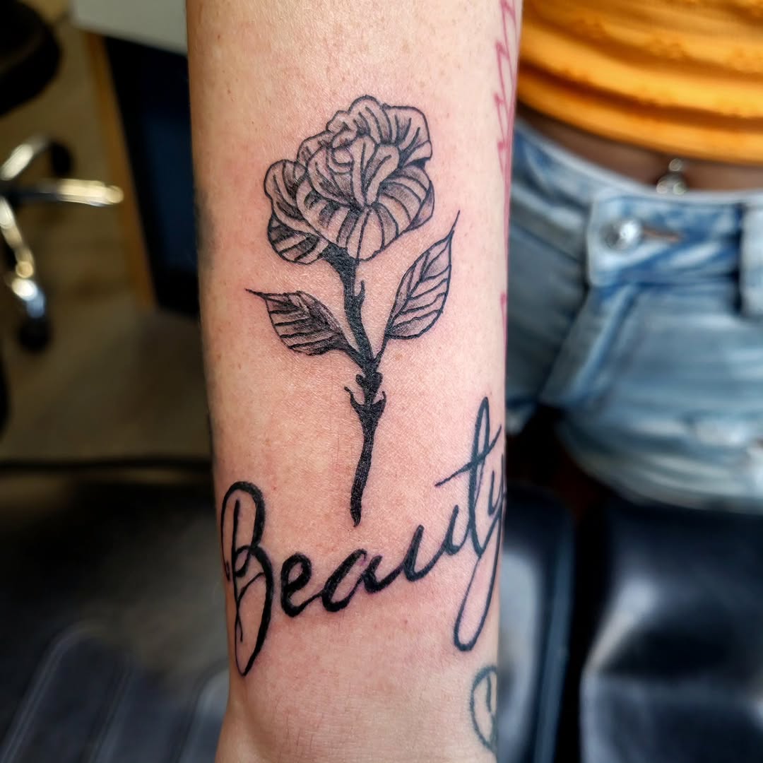 Tattoo by @cryingwoof — lettering_script, black_and_grey