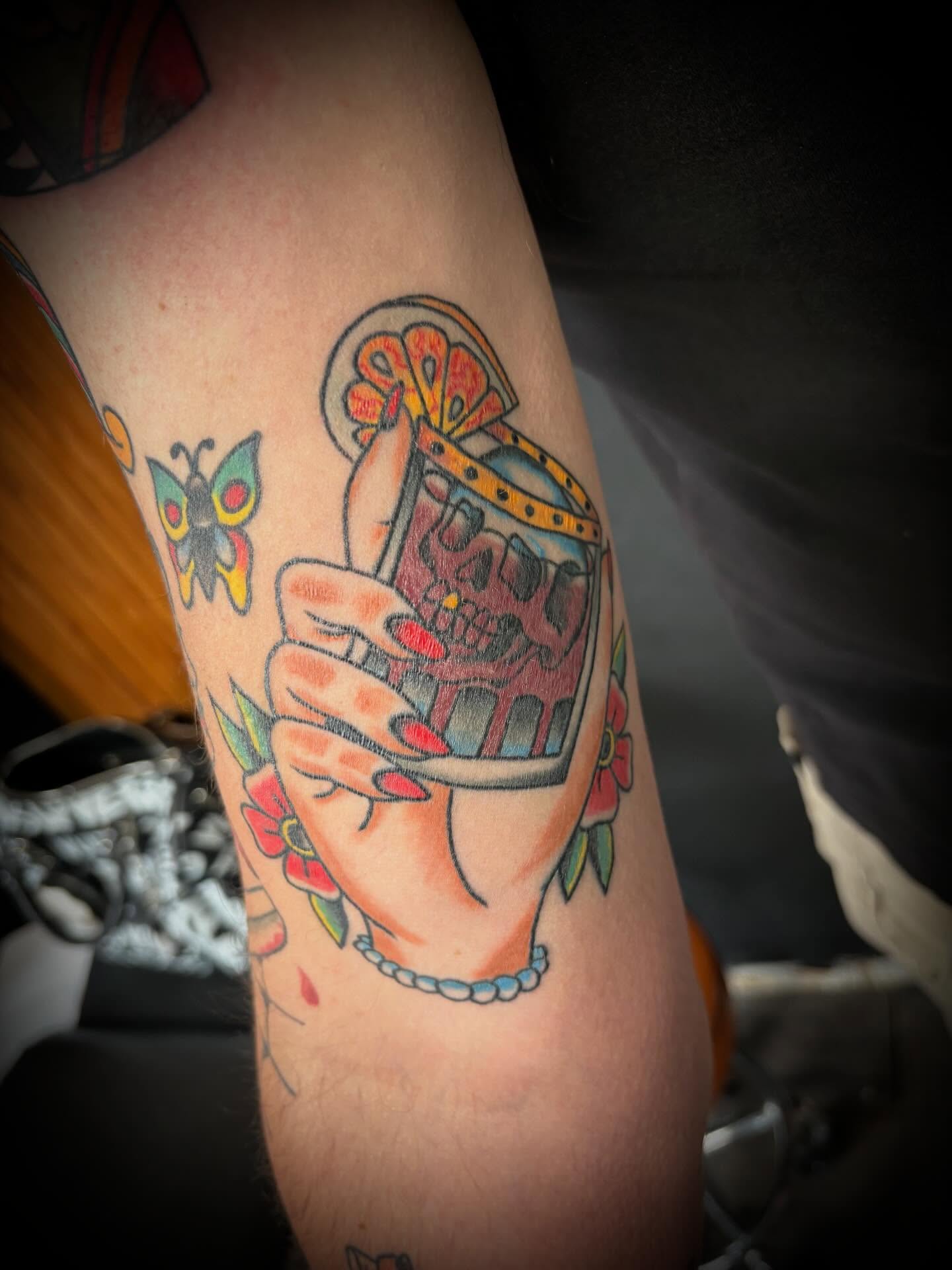 Skull in glass American traditional tattoo on the forearm by Gardner, Gardner, Massachusetts