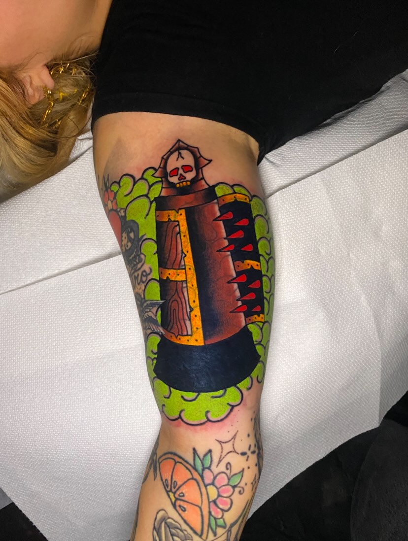 Skull in coffin American traditional tattoo on the thigh by Nosferatu