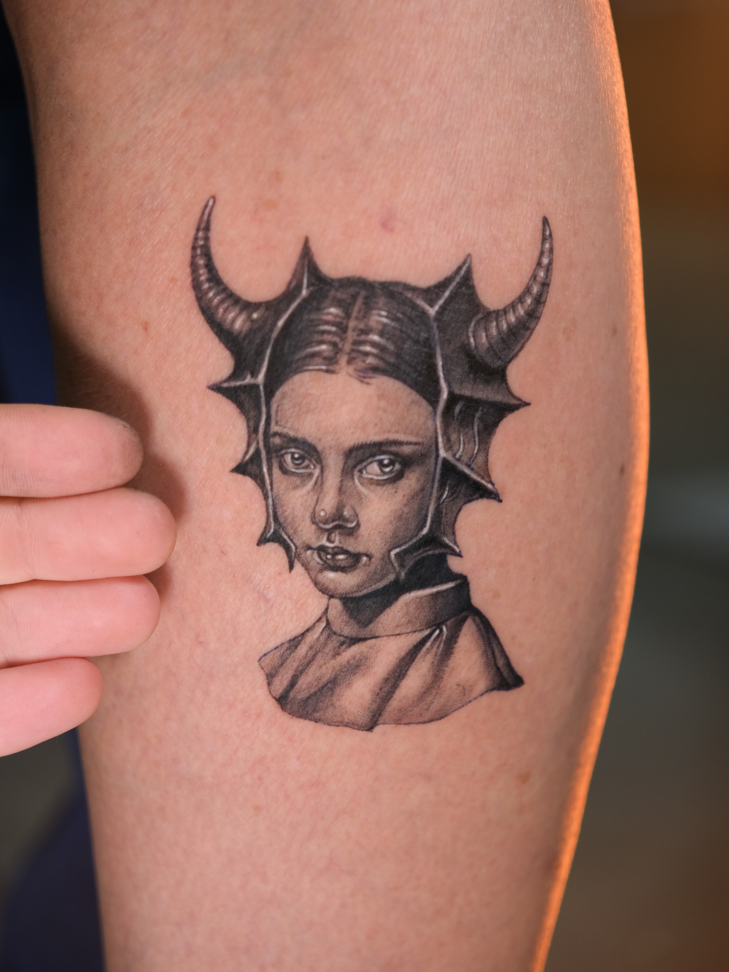 Woman with horns realism tattoo on the forearm by Tattoo Miami π