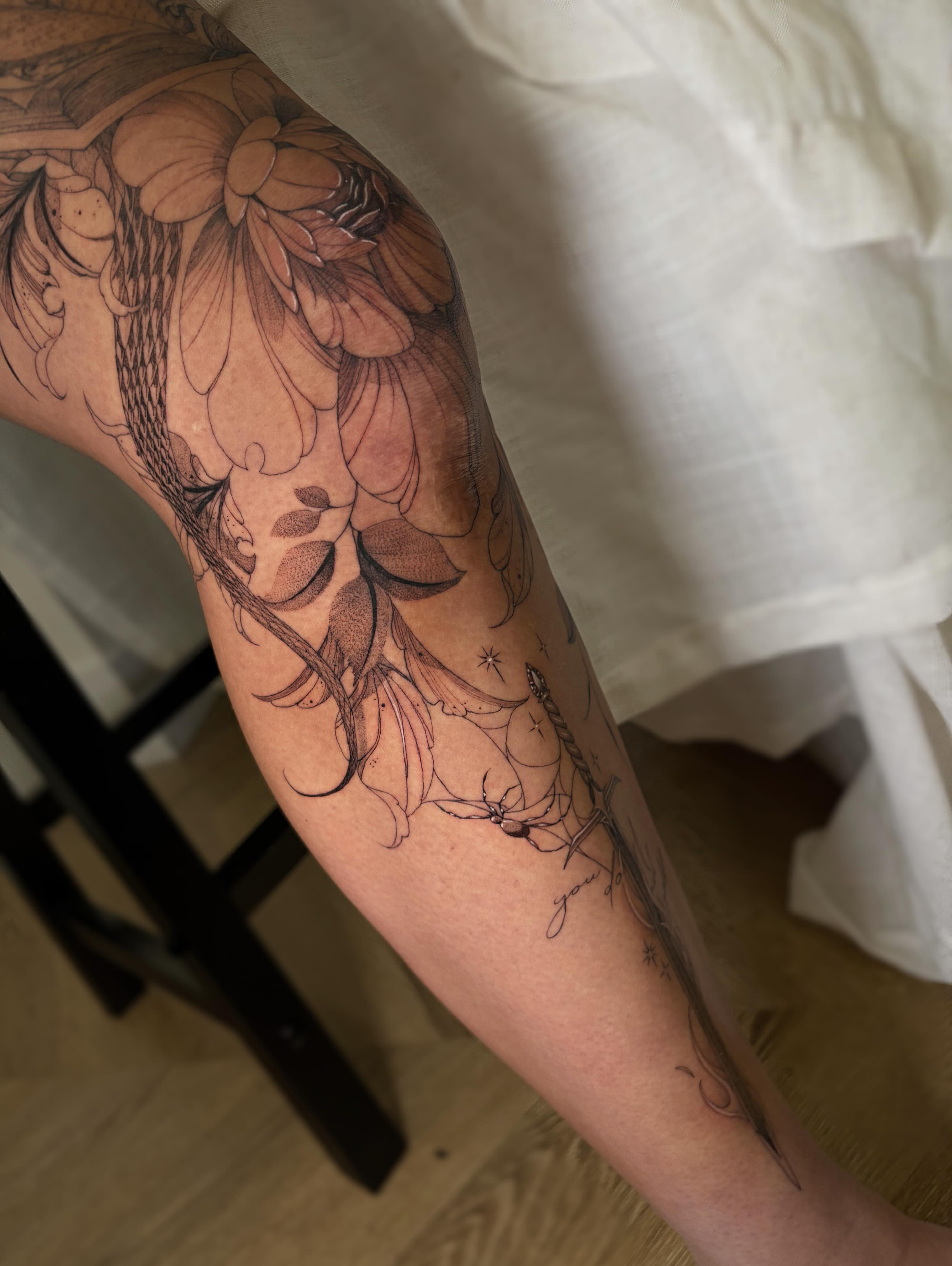 Floral design black and grey tattoo on the forearm by Justene Renee 🖤 Fine Line Tattoo Artist