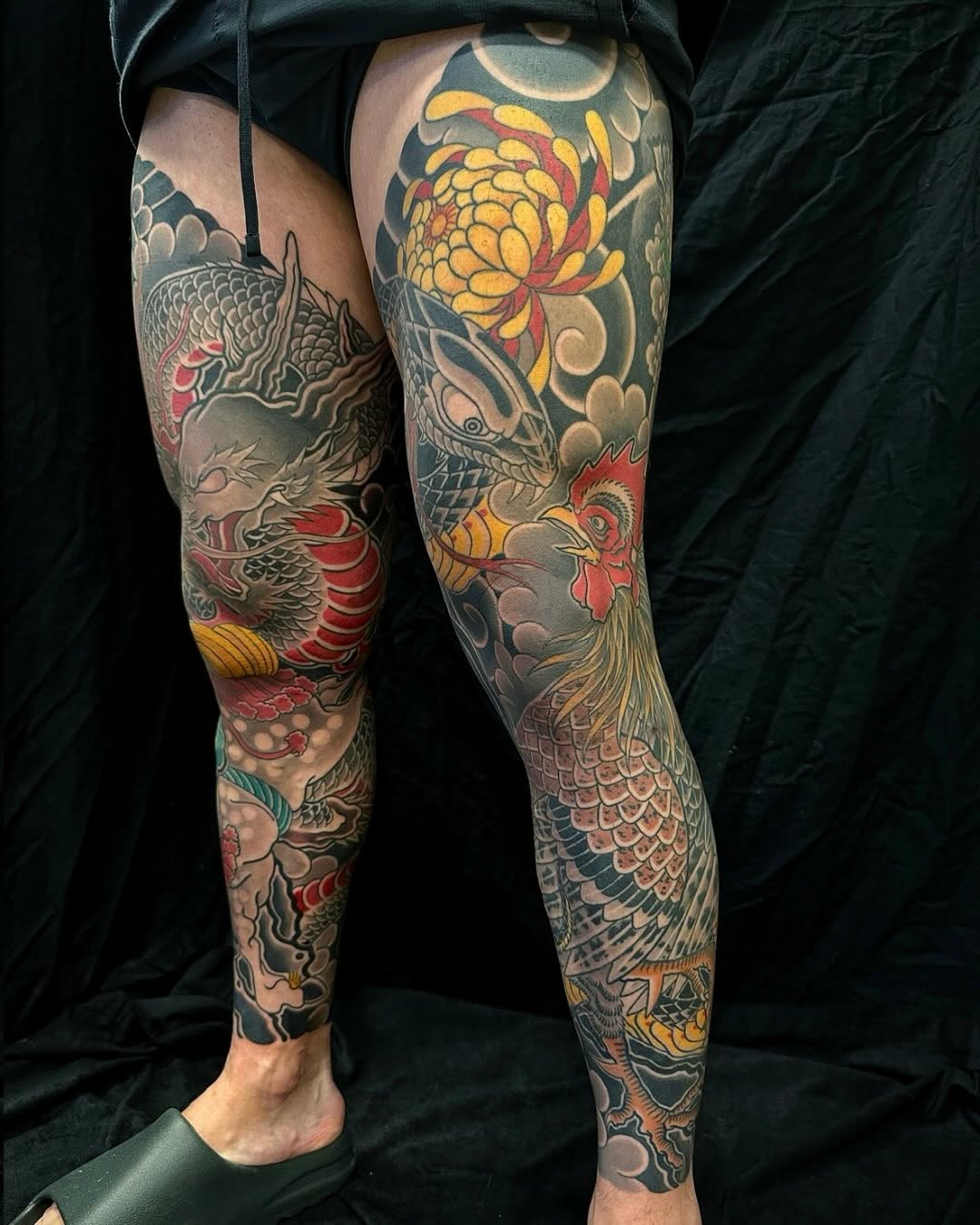 Dragon, rooster, and chrysanthemum Japanese tattoo on the leg by Xiaojun Yin, Vancouver, British Columbia