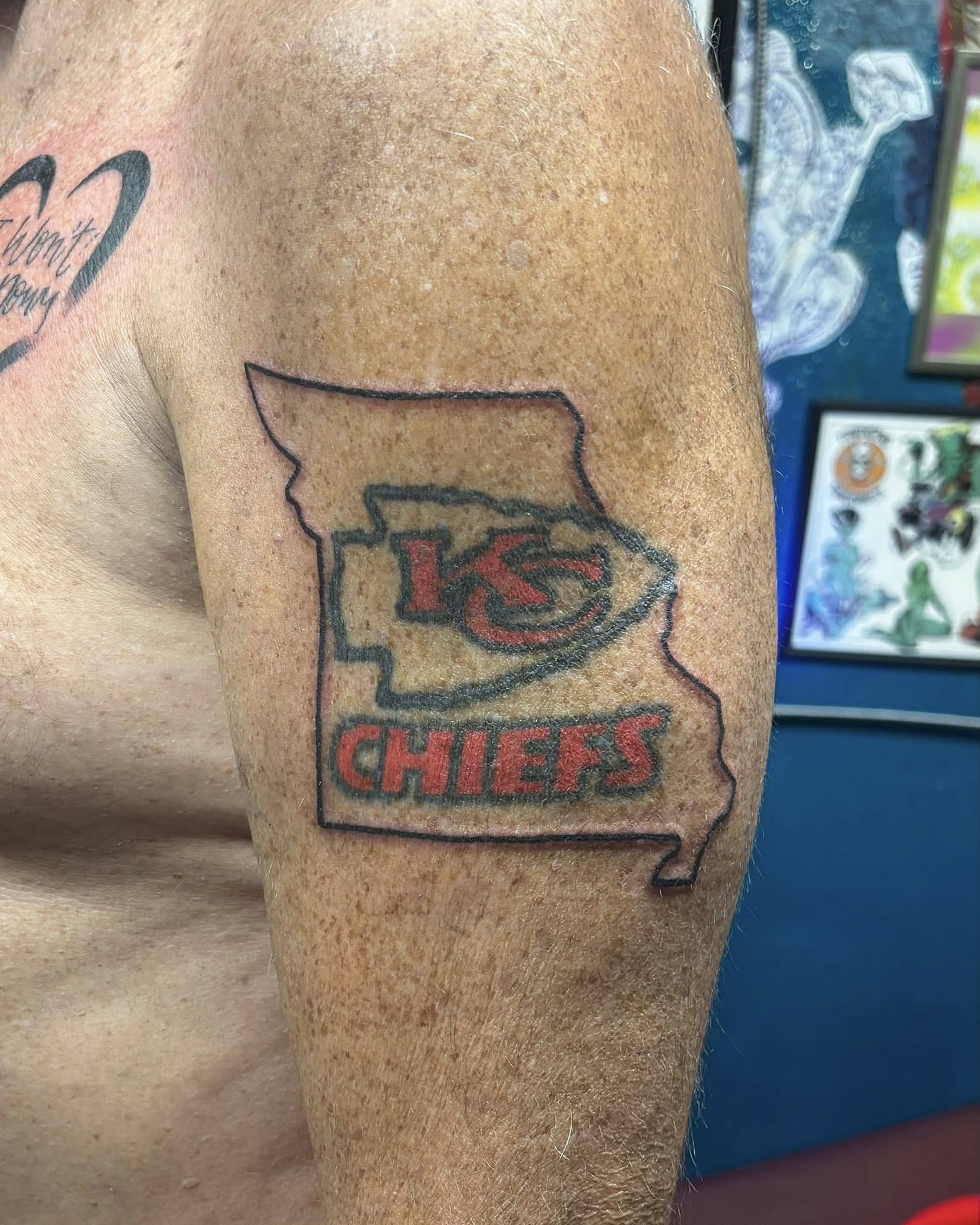 KC Chiefs logo American traditional tattoo on the forearm by Jeff Zuptich