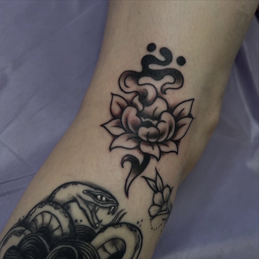 Lotus flower black and grey tattoo on the forearm by Chelsea Graham, Seattle, Washington