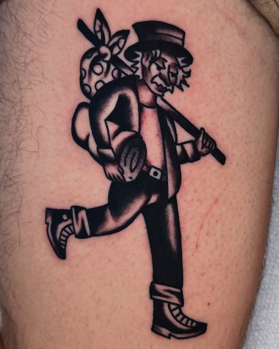 Gangster with gun black and grey tattoo on the thigh by Sean Michel, Nashua, New Hampshire