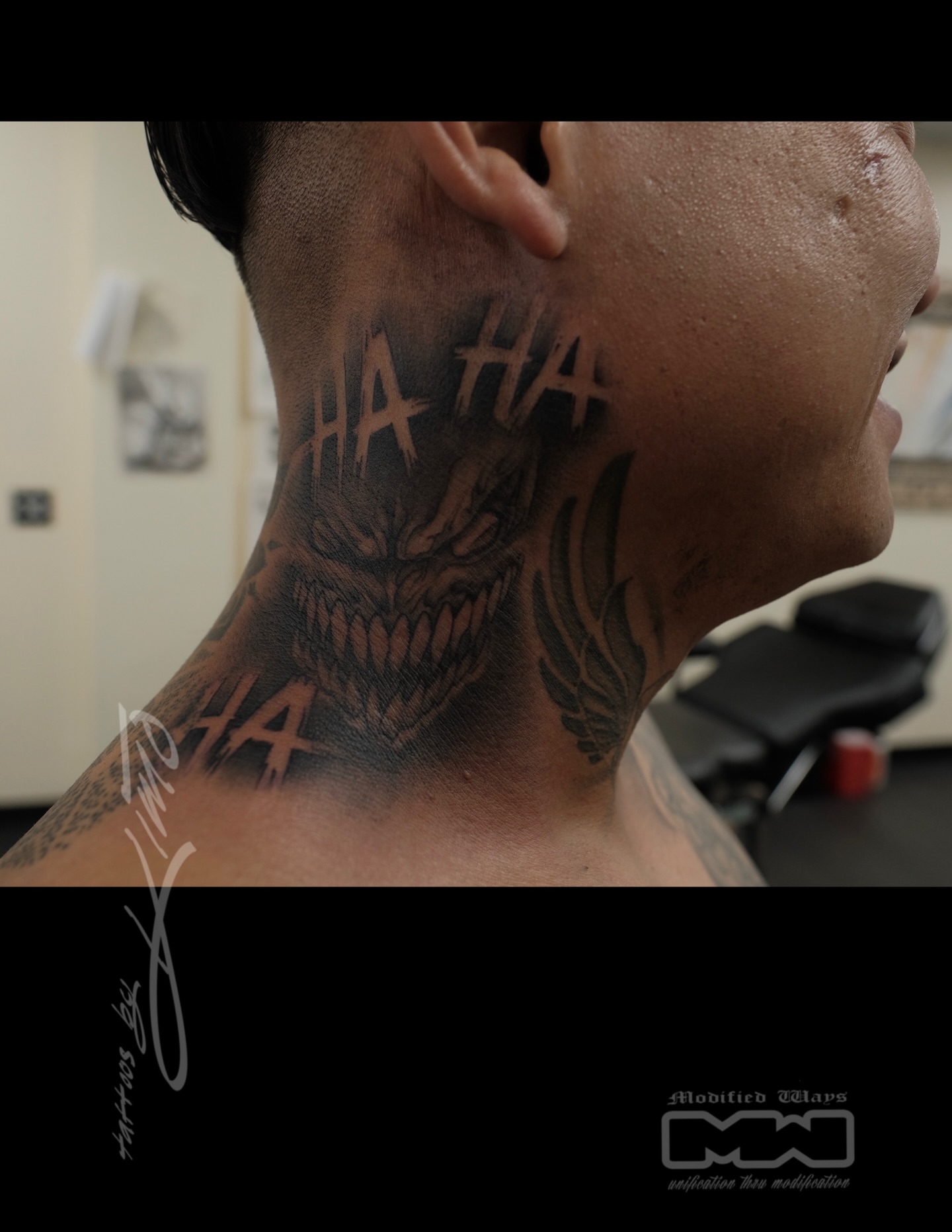 Joker black and grey tattoo on the neck by Kansas City tattoo artist