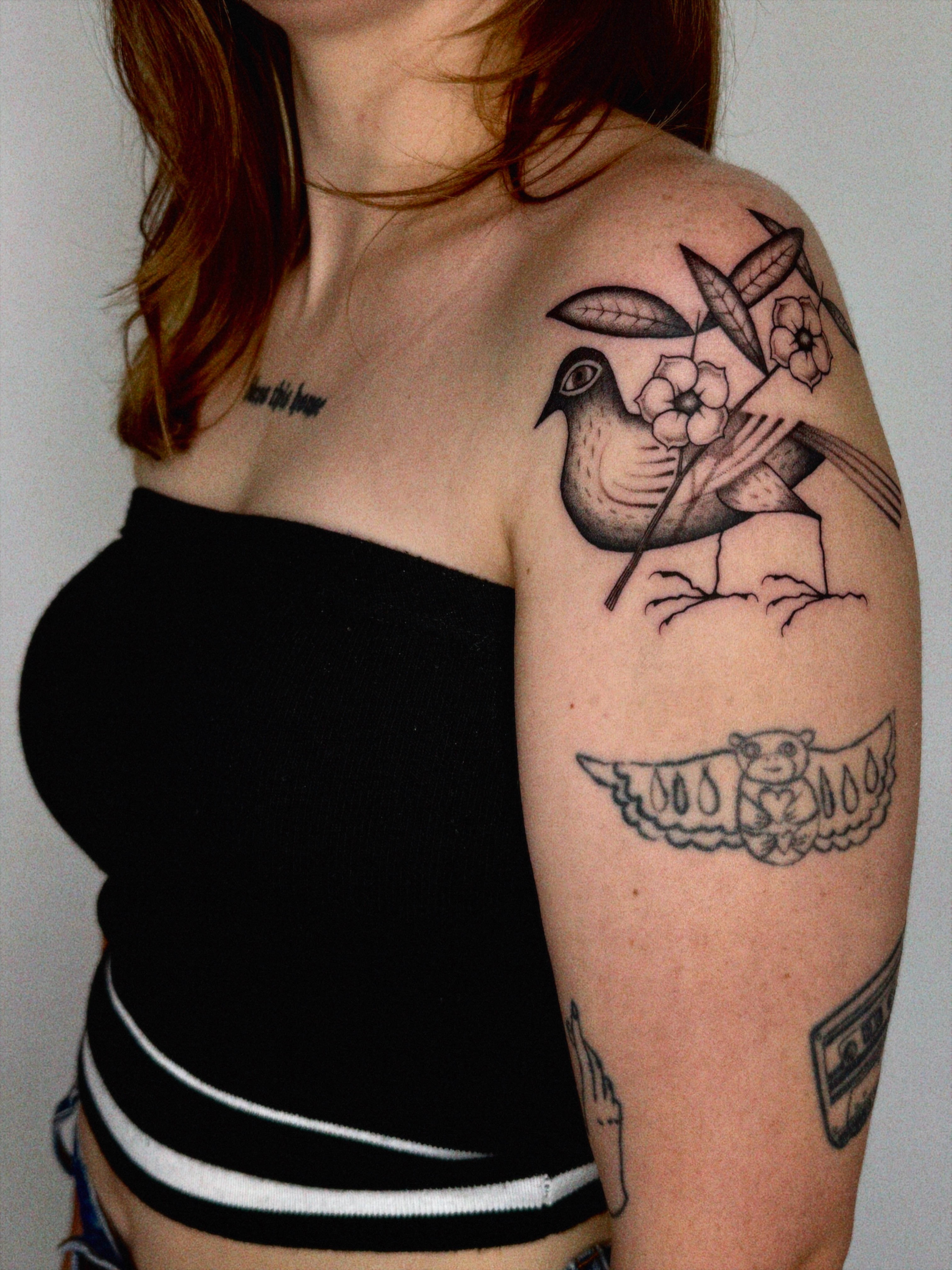 Bird and flower black and grey tattoo on the shoulder by @inkshame