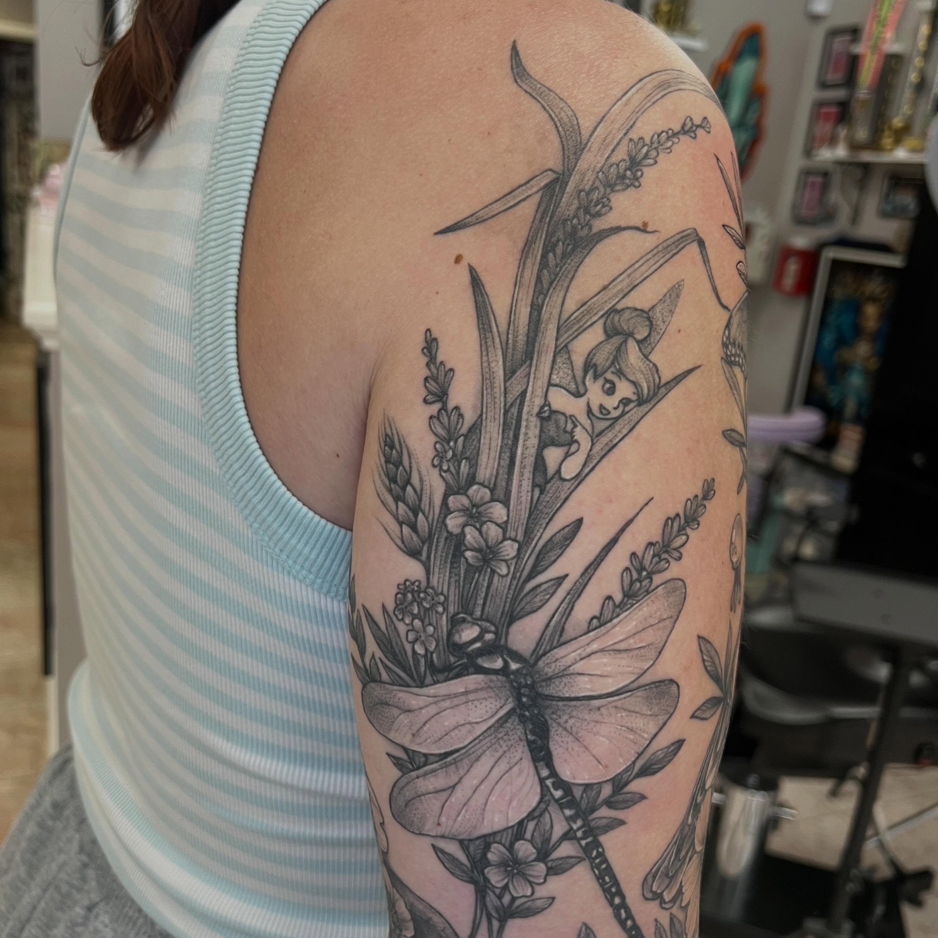 Fairy and dragonfly realism tattoo on the upper arm by Bridget Aurore