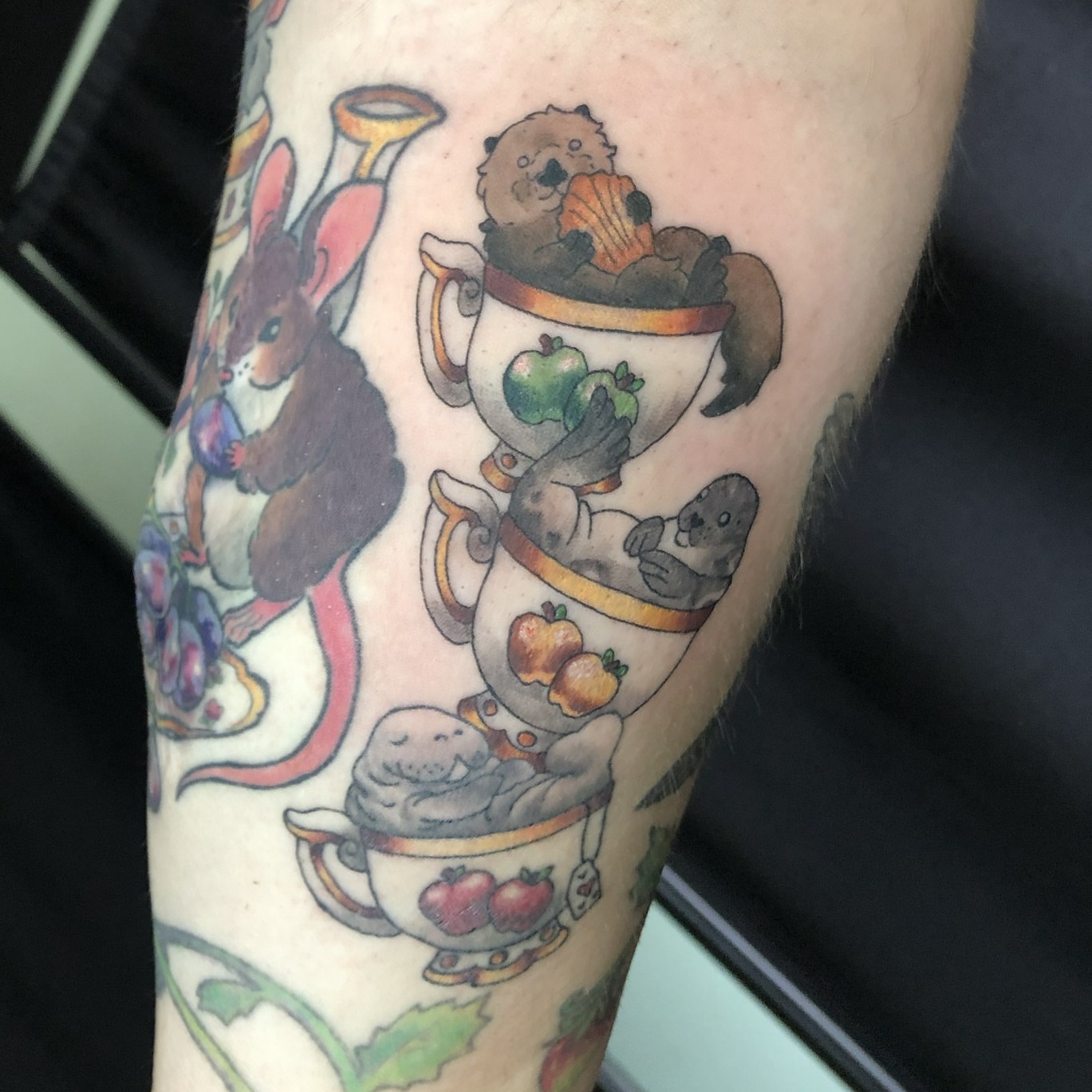 Mice in teacups new school tattoo on the forearm by Rowan Lee