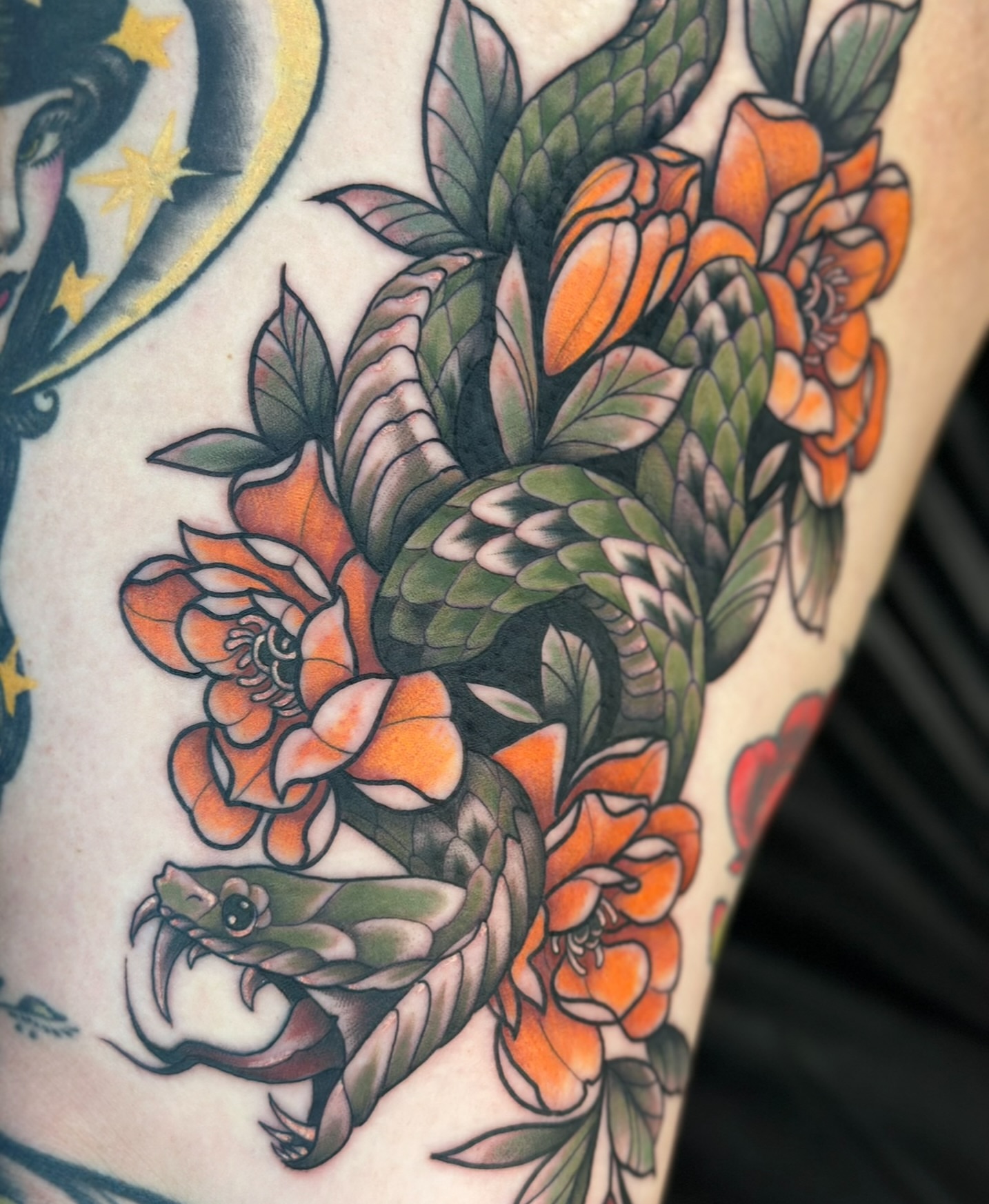 Snake and peony American traditional tattoo on the thigh by Feliz Manzanedo, Prescott, Arizona