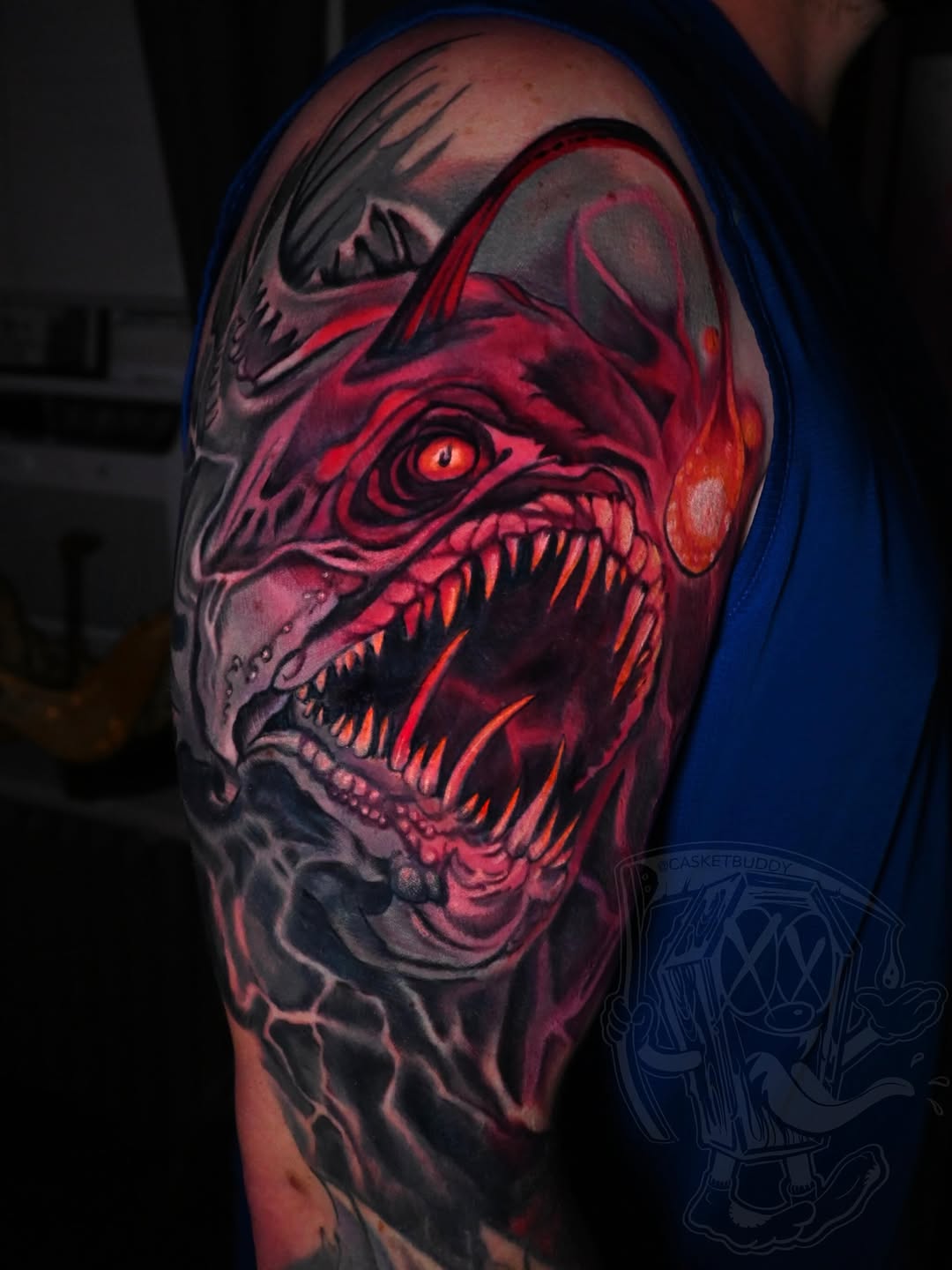 Monster face dark art tattoo on the shoulder by William Pollock