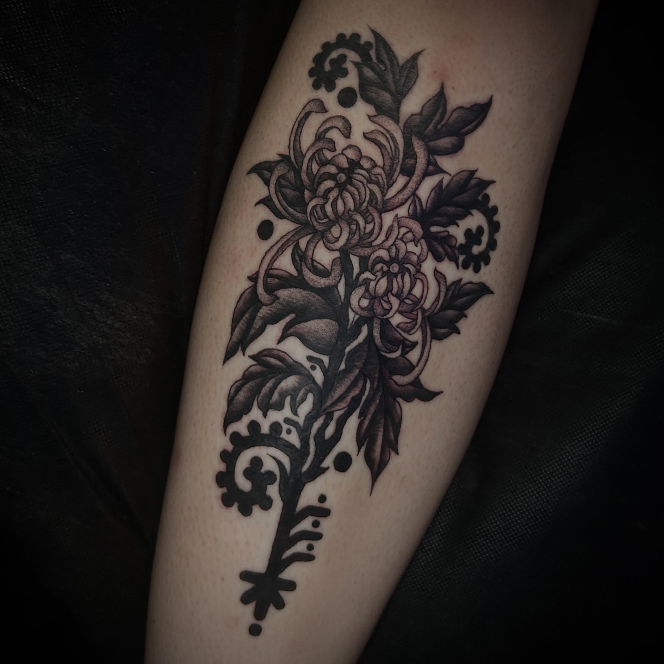 Floral bouquet ornamental tattoo on the forearm by Kat McCoy Guidera, Nashville, Tennessee