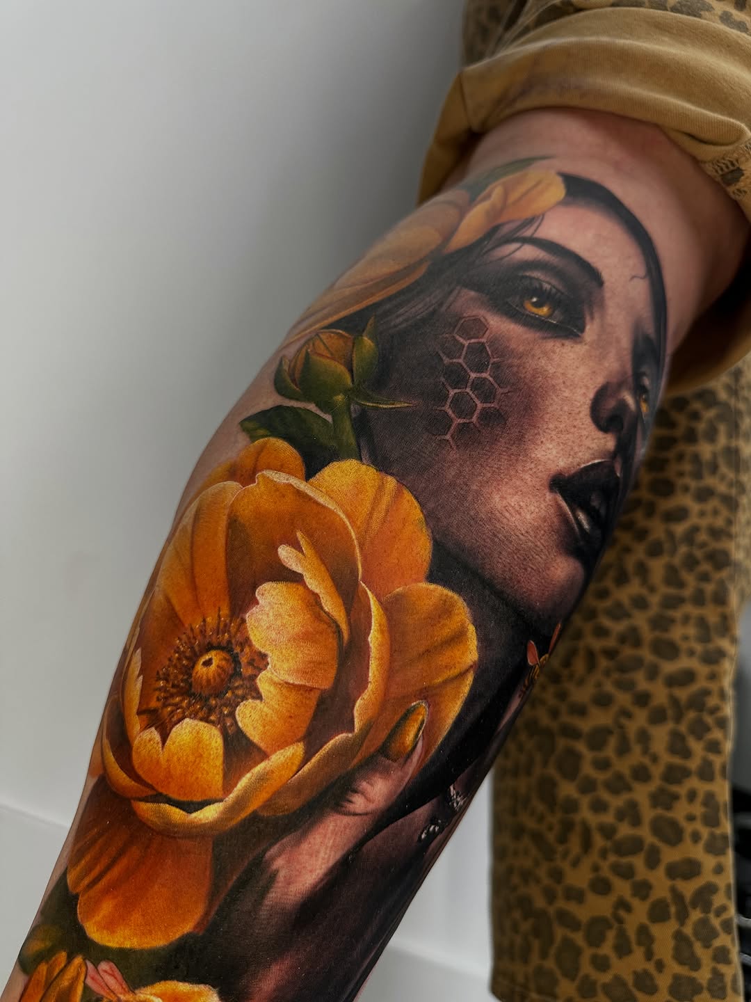Woman with flower neo-traditional tattoo on the forearm by Dakota Case