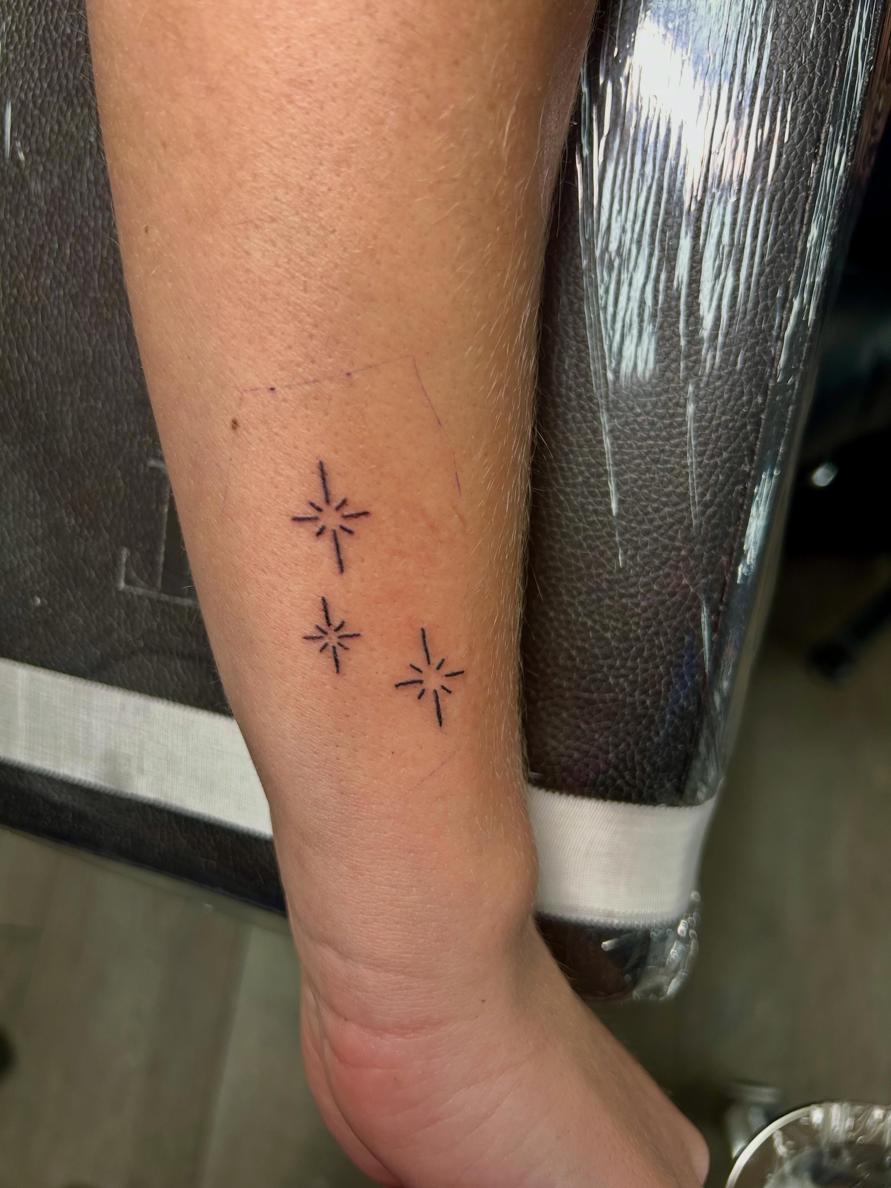 Stars fine line tattoo on the forearm by Bjorn Bjornstad, Dubuque, Iowa