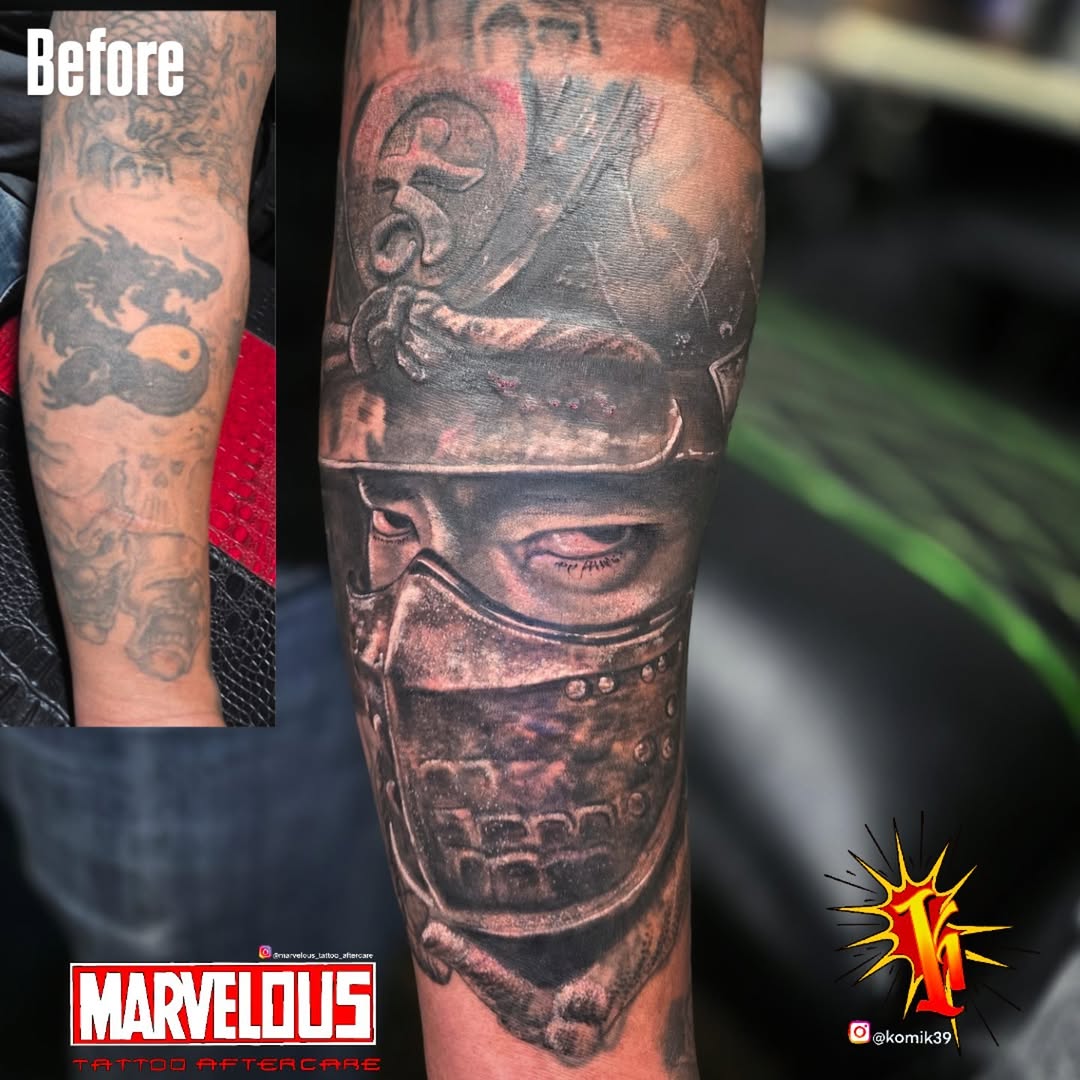 Armored face realism tattoo on the forearm by komik tattoos