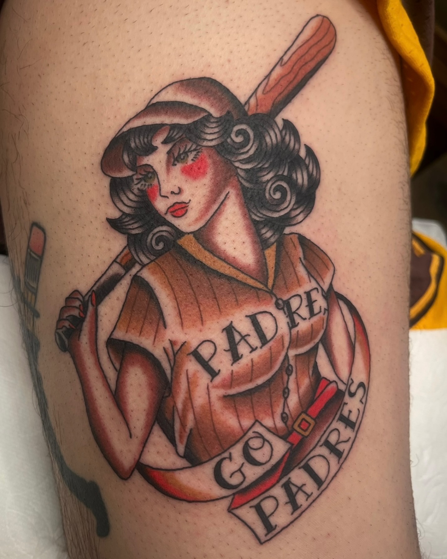 Baseball pin-up girl American traditional tattoo on the thigh by Tiffani Thompson, San Diego, California