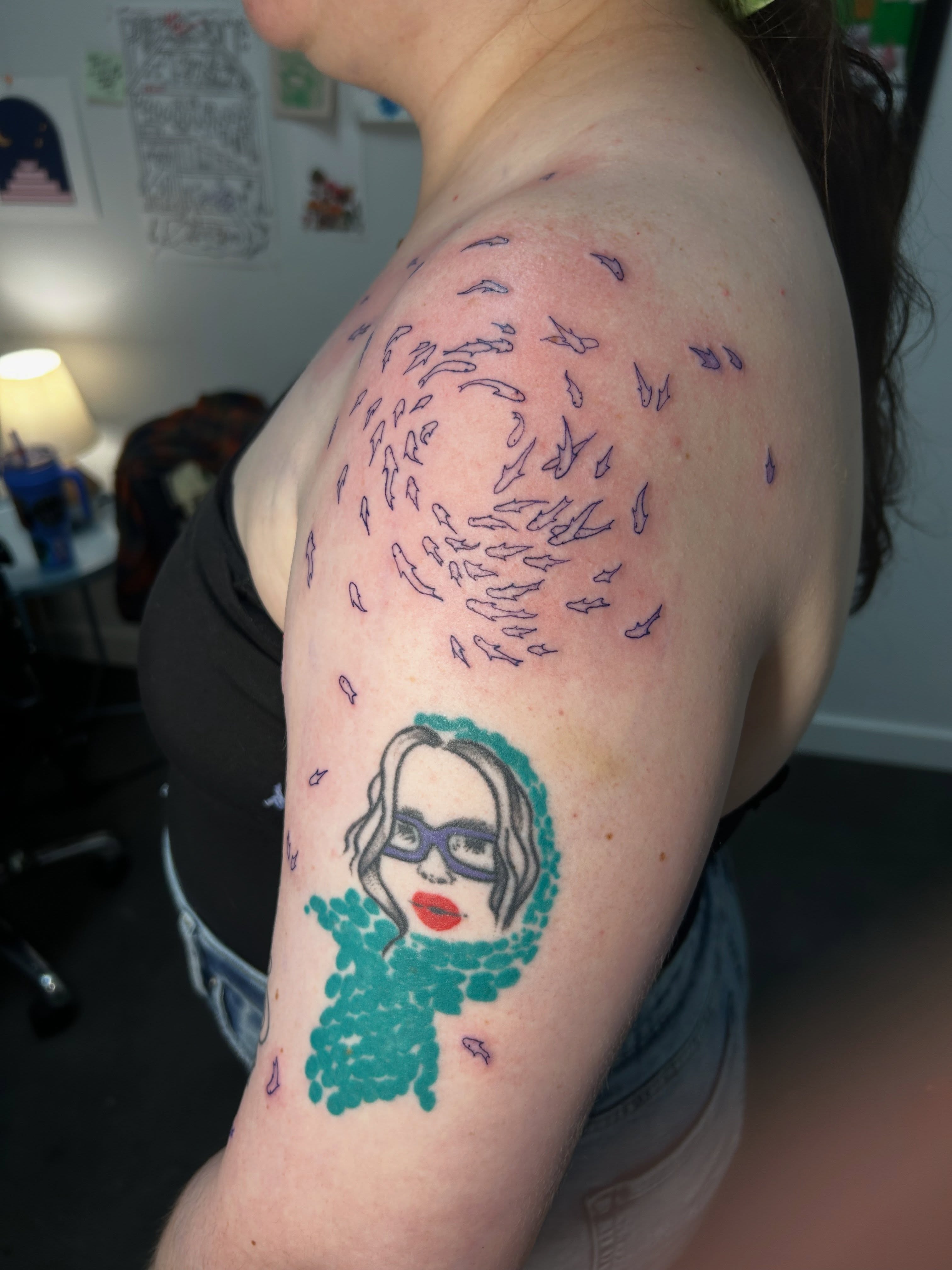 Portrait with fish new school tattoo on the shoulder by Mattie Robinson