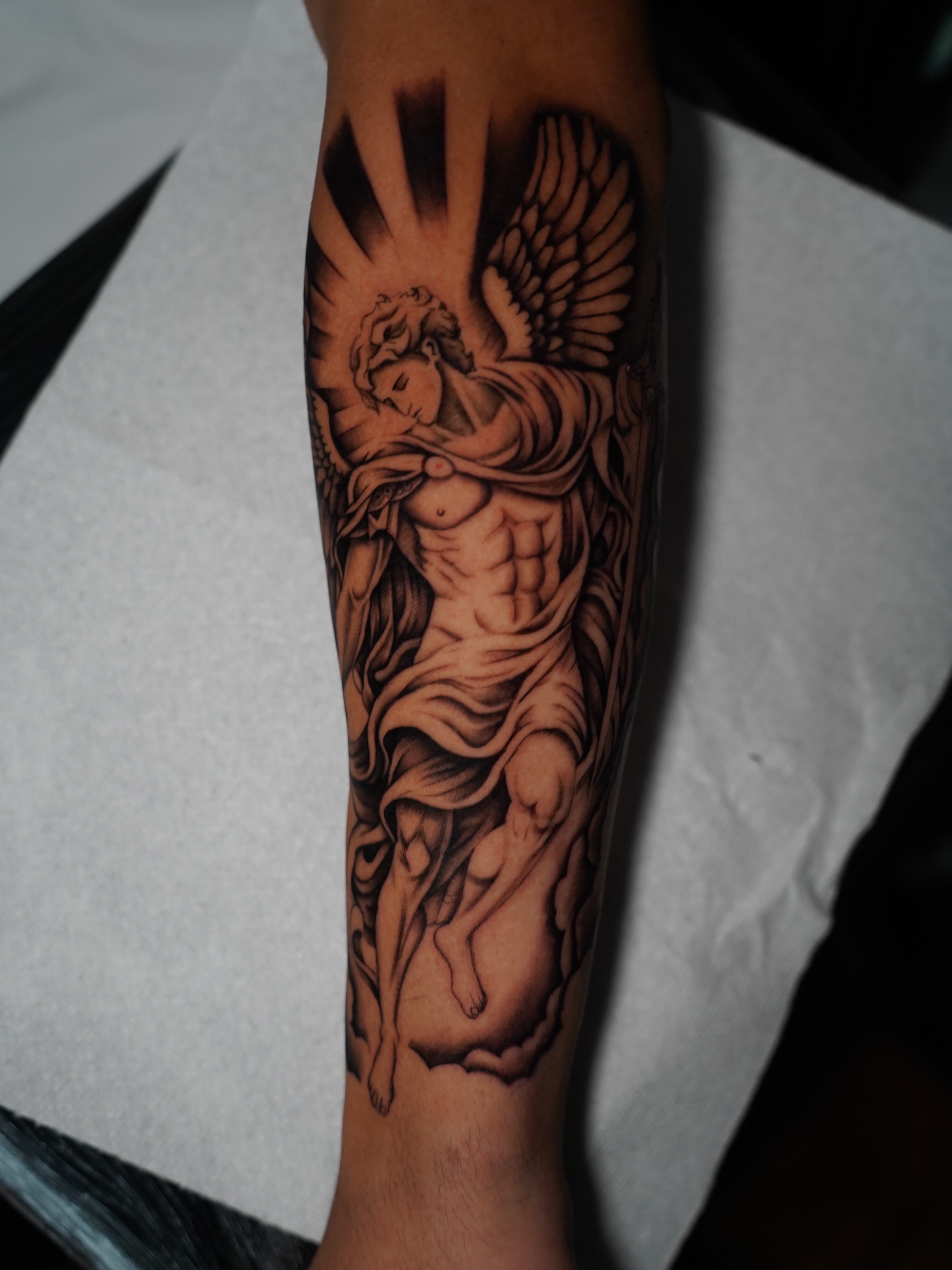 Angelic figure realism tattoo on the forearm by Dallas Tattoo Artist