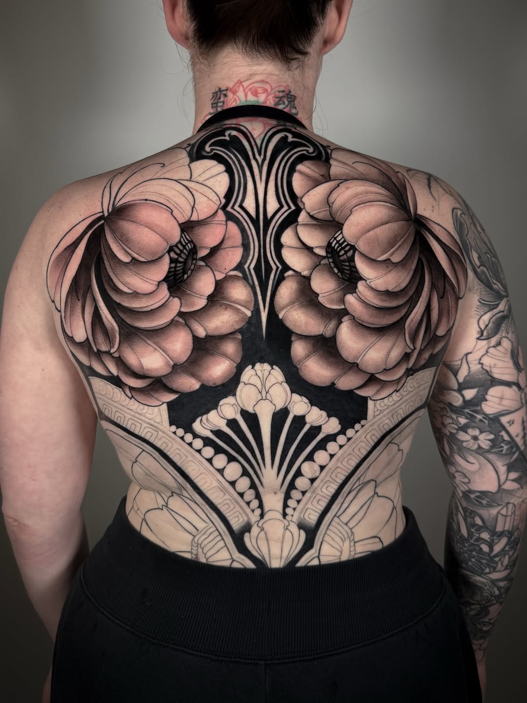 Floral back piece geometric tattoo on the back by Carlos Valdes ✨ Tattoo Artist in Tampa FL
