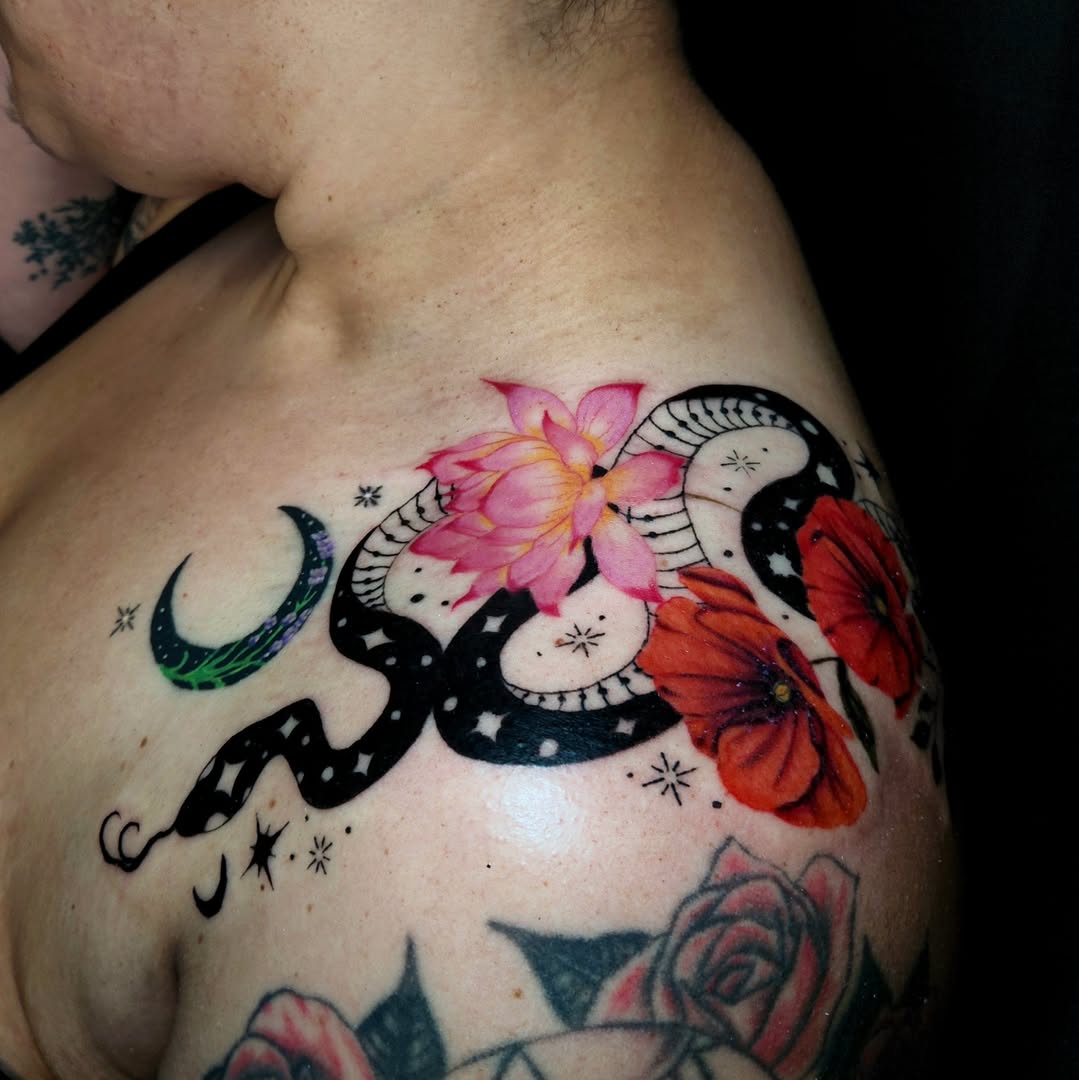 Snake and flowers dotwork tattoo on the chest by Ashly Renee