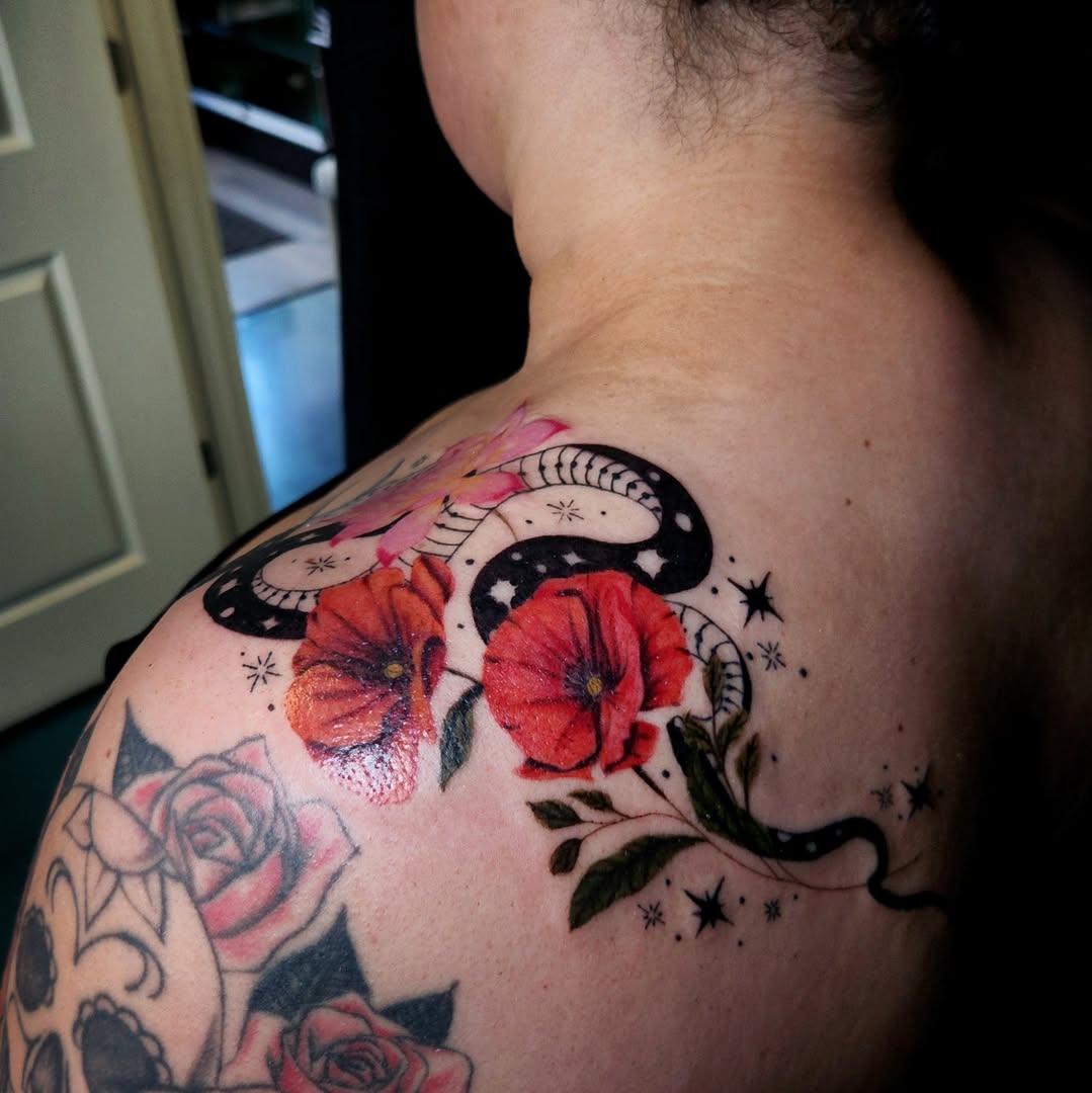 Snake and poppies American traditional tattoo on the shoulder by Ashly Renee